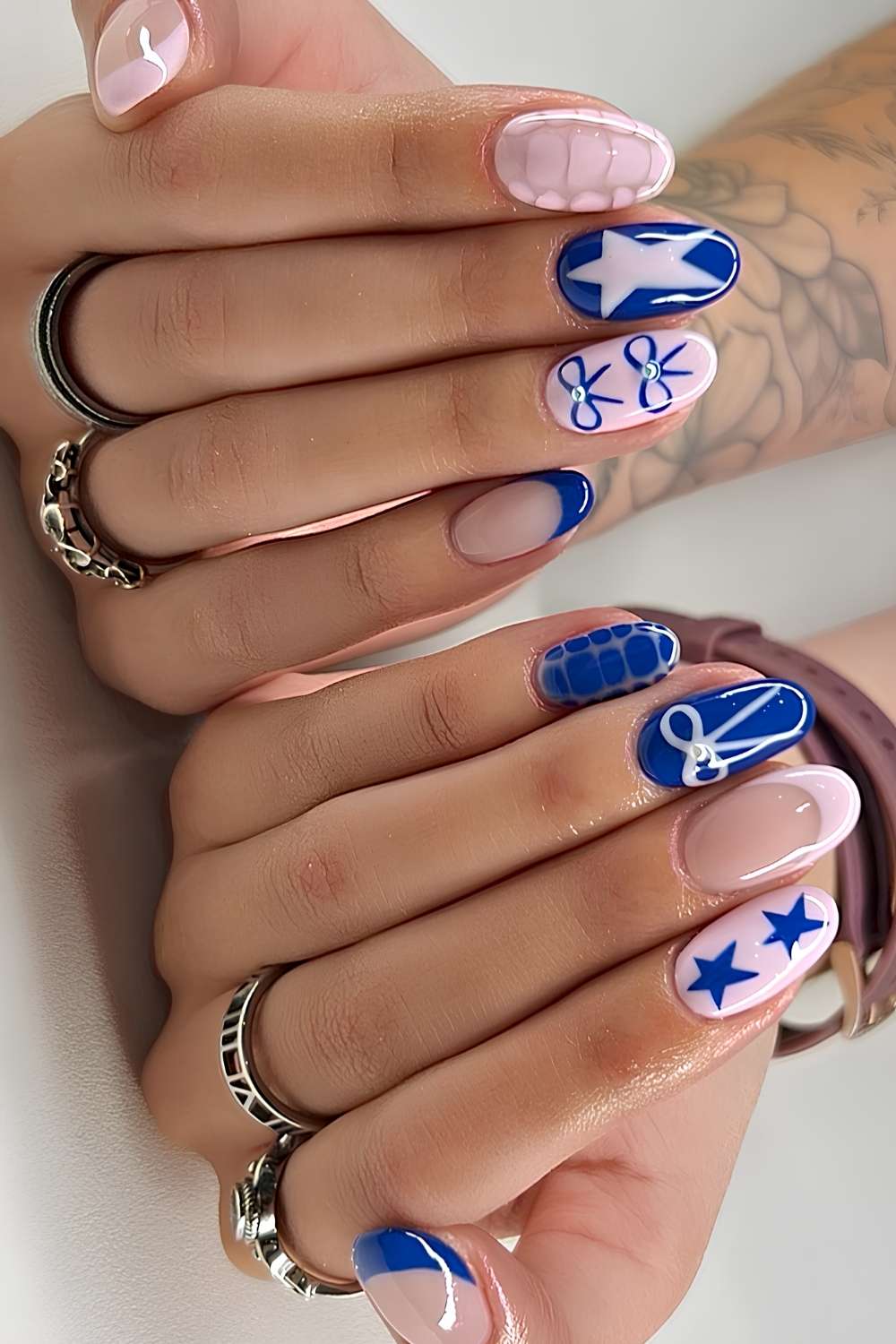 Pink and blue nails with stars and bows