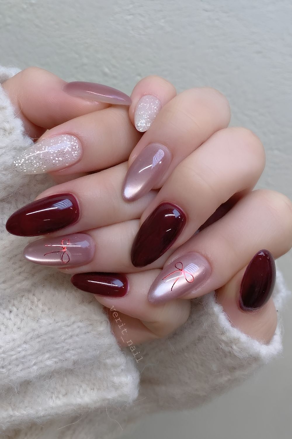 Pink and burgundy nails with mixed textures