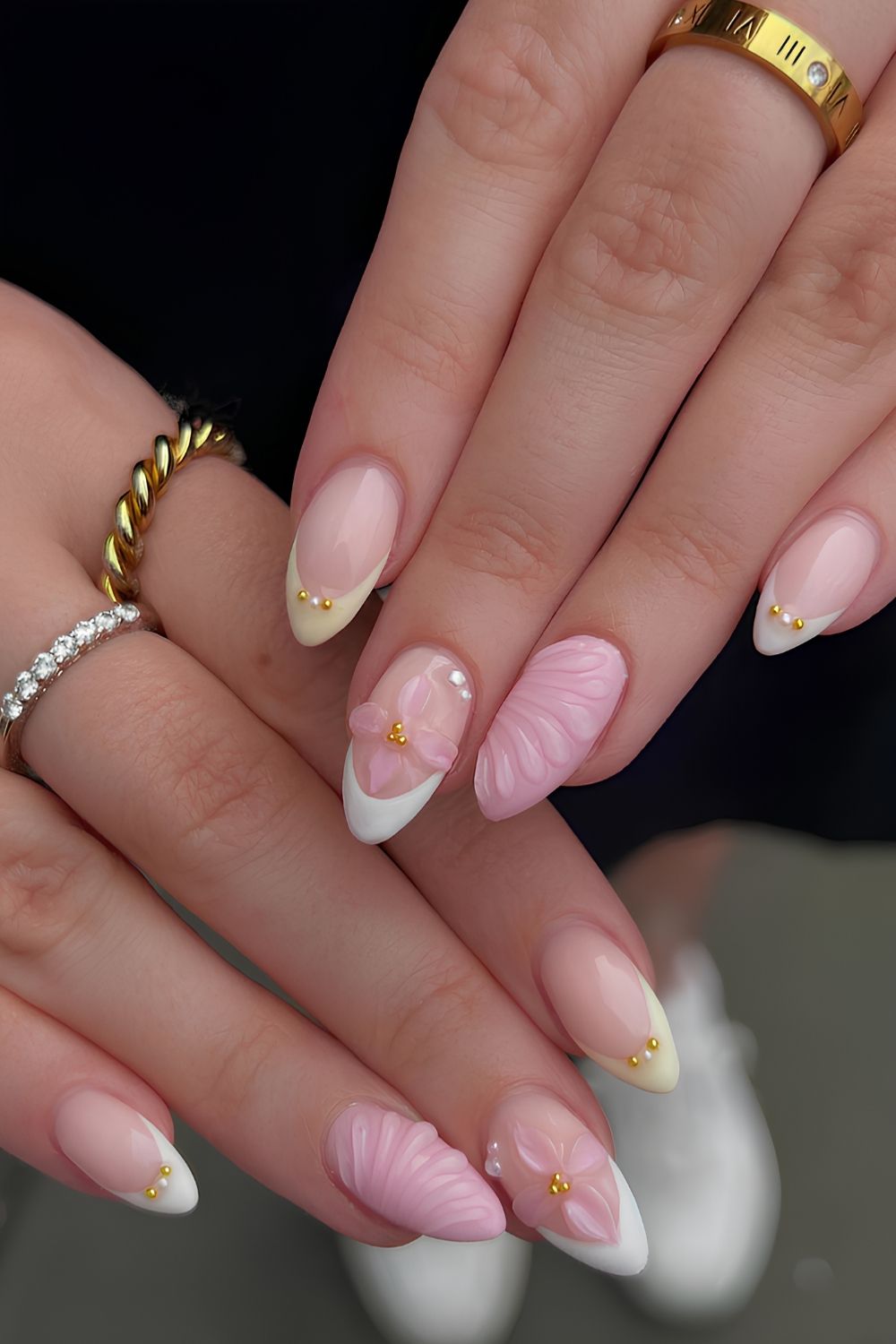 Pink and butter yellow nails with pearls and flowers