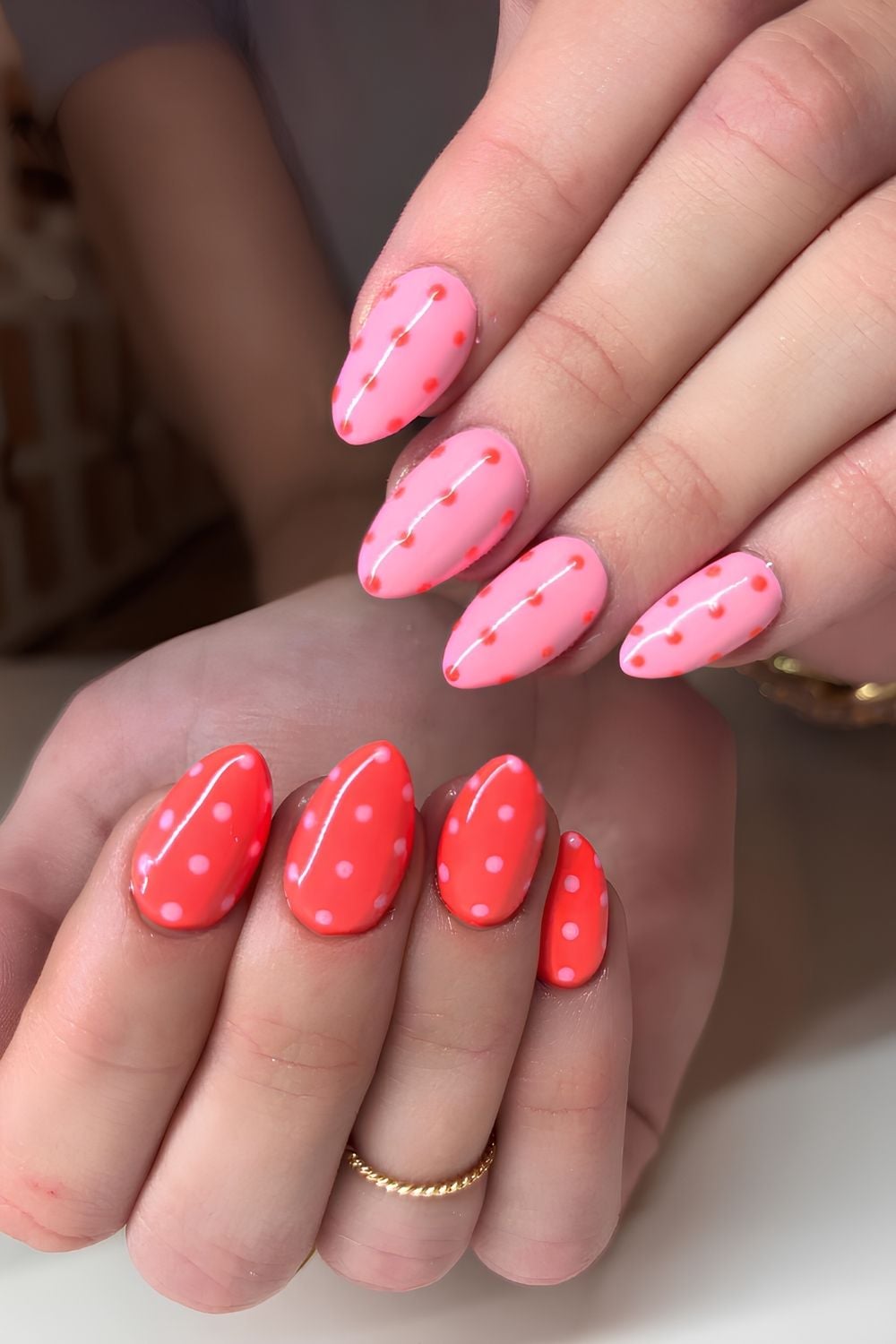 Pink and coral nails with micro dot accents