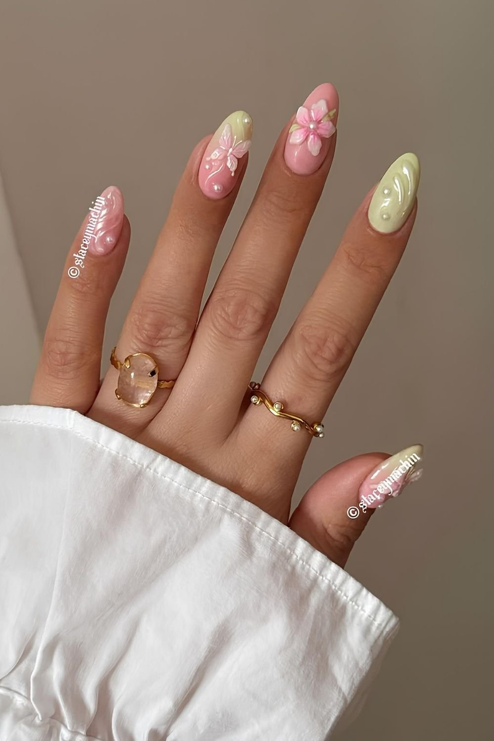 Pink and creamy green nails with 3d flowers, butterflies and pearls