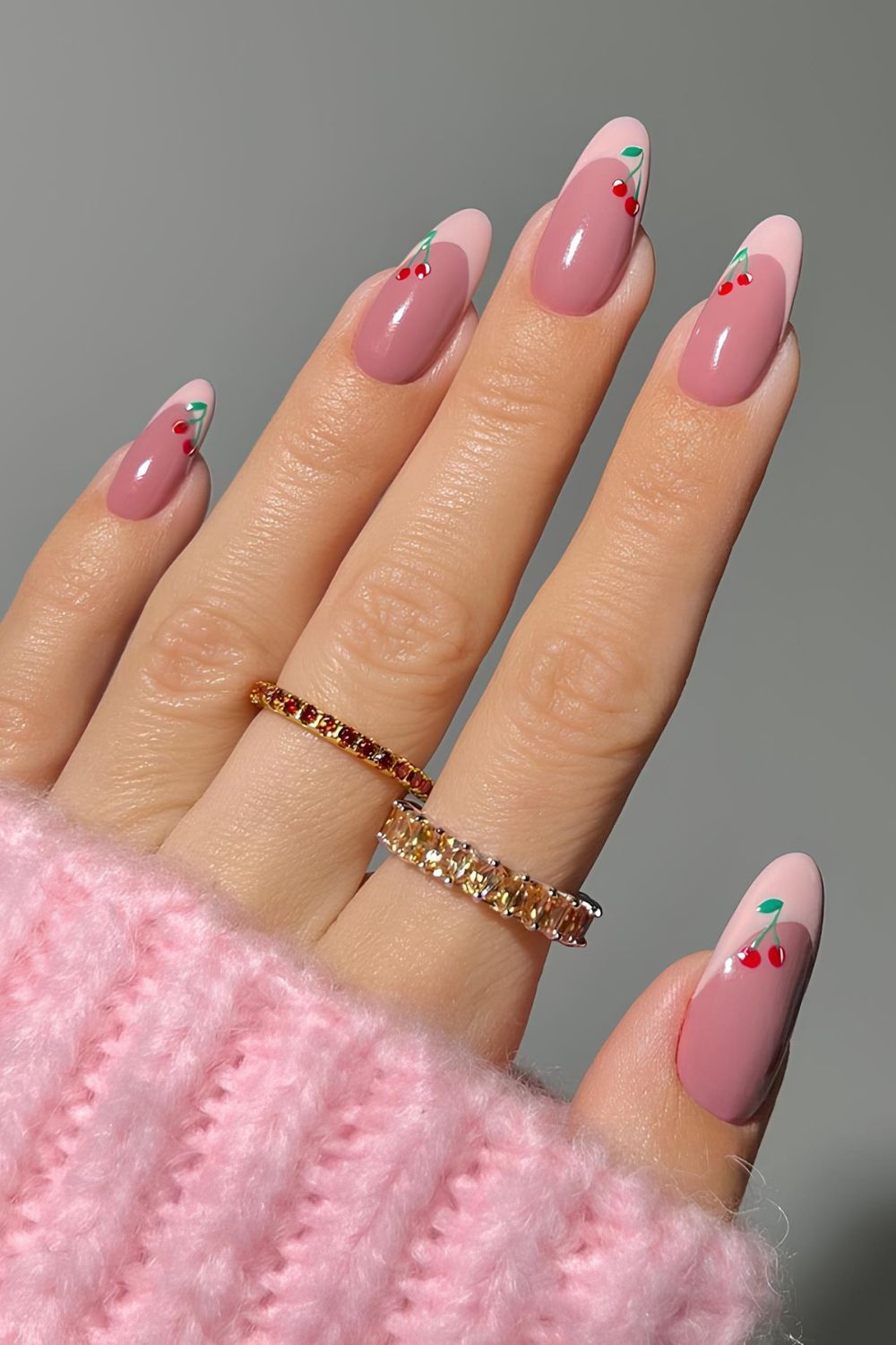 Pink and mauve French nails with cherry accents