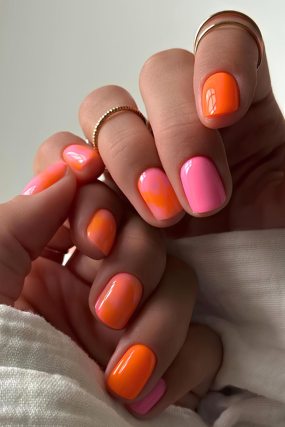 Pink and orange marble nails