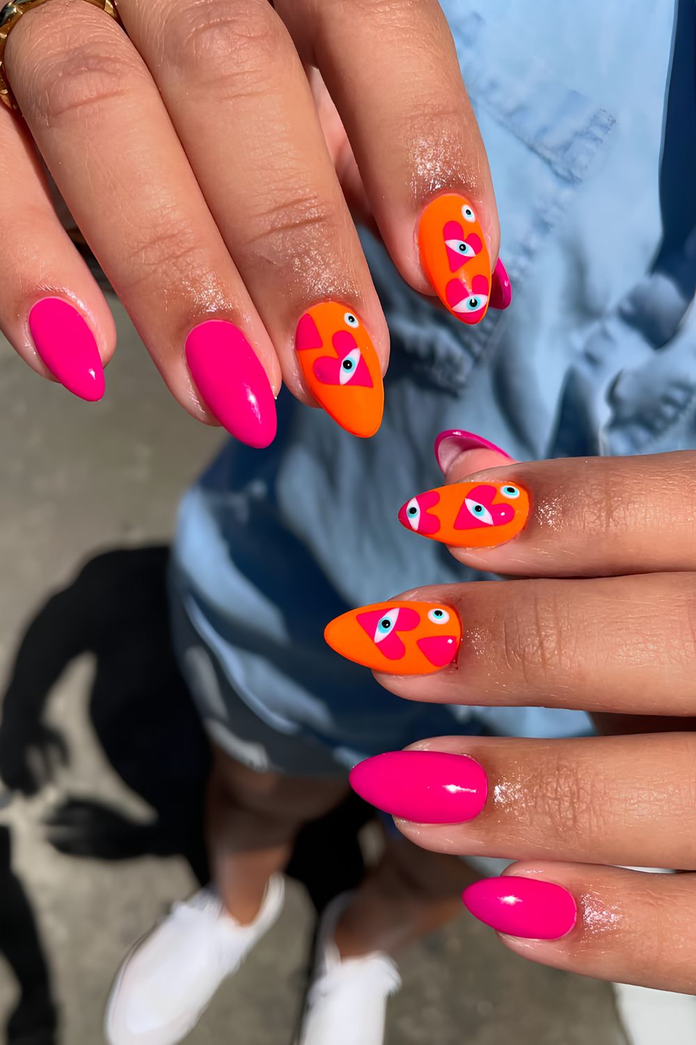 Pink and orange nails with heart nazar design