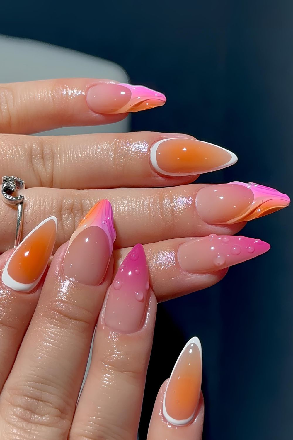 Pink and orange nails with mix and match design