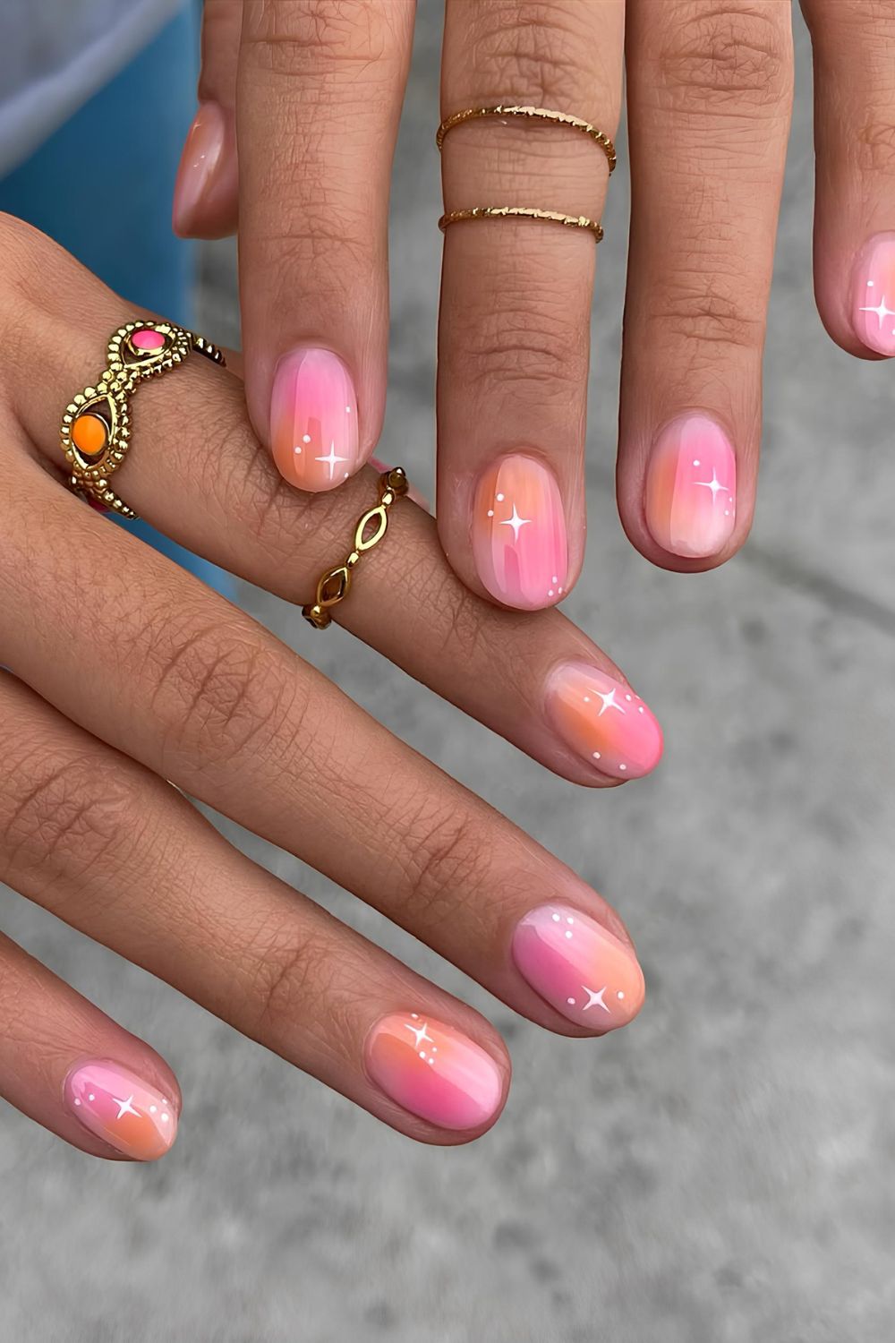 Pink and orange ombre nails with white stars