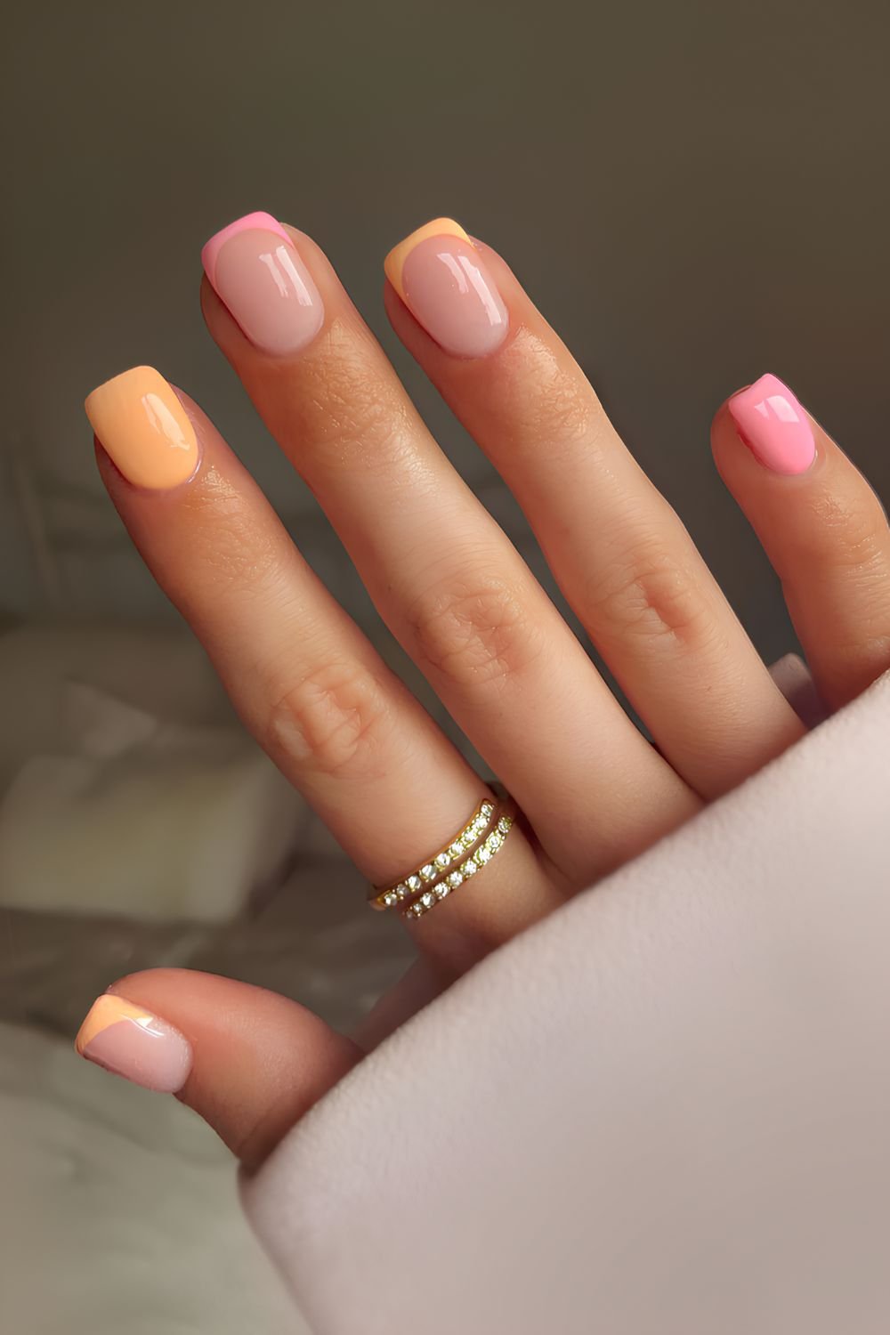 Pink and pastel orange manicure