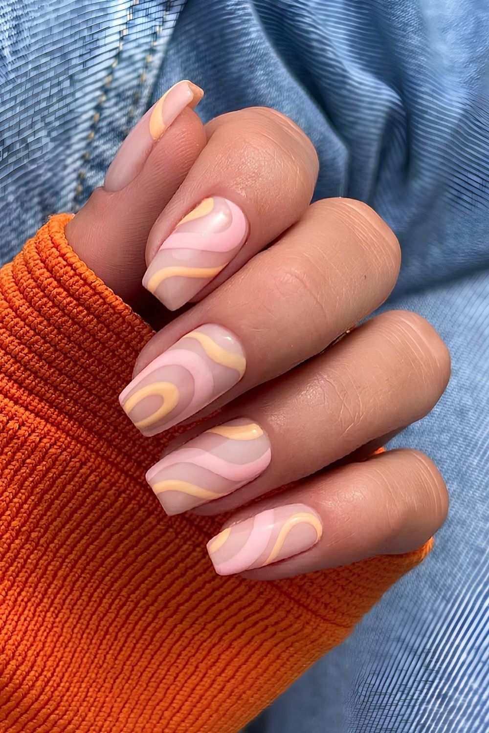 Pink and peach swirly pastel nails