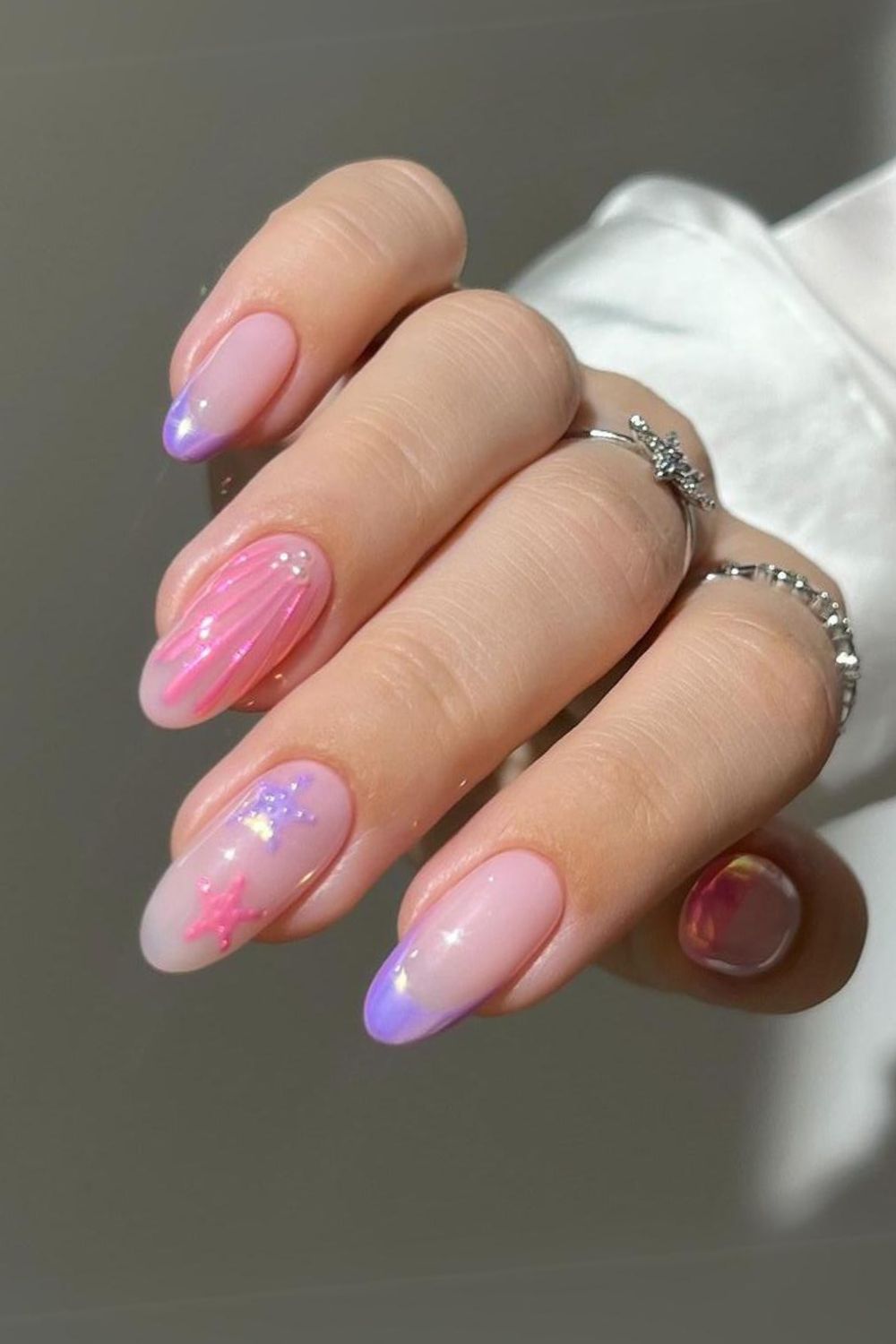 Pink and purple nails with seashell art