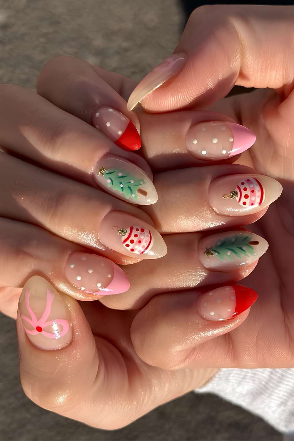Pink and red French mani with Christmas motifs