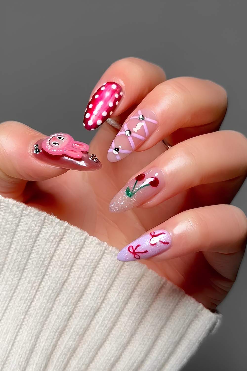 Pink and red mix and match nails with labubu accents
