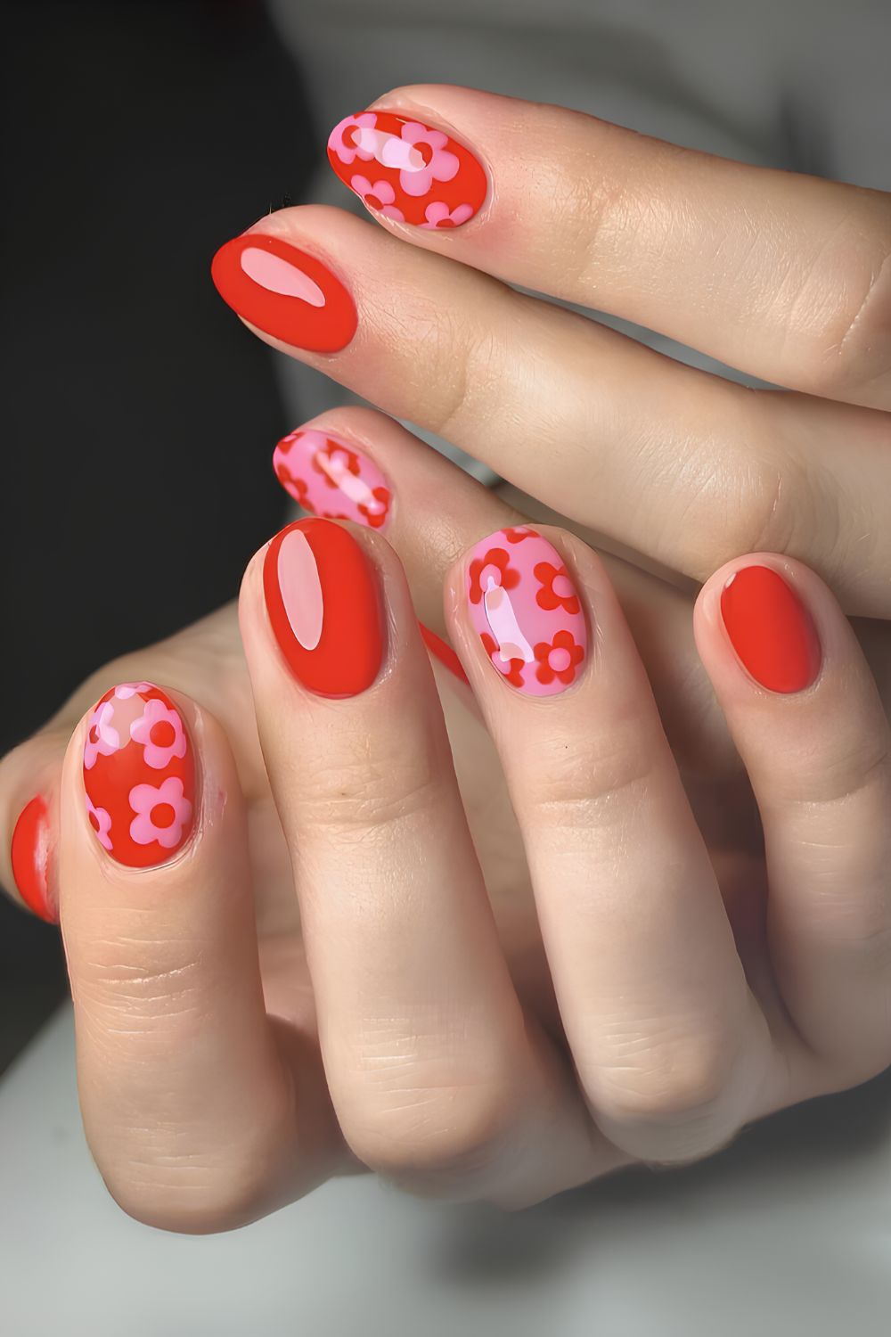 Pink and red nails with tiny flowers