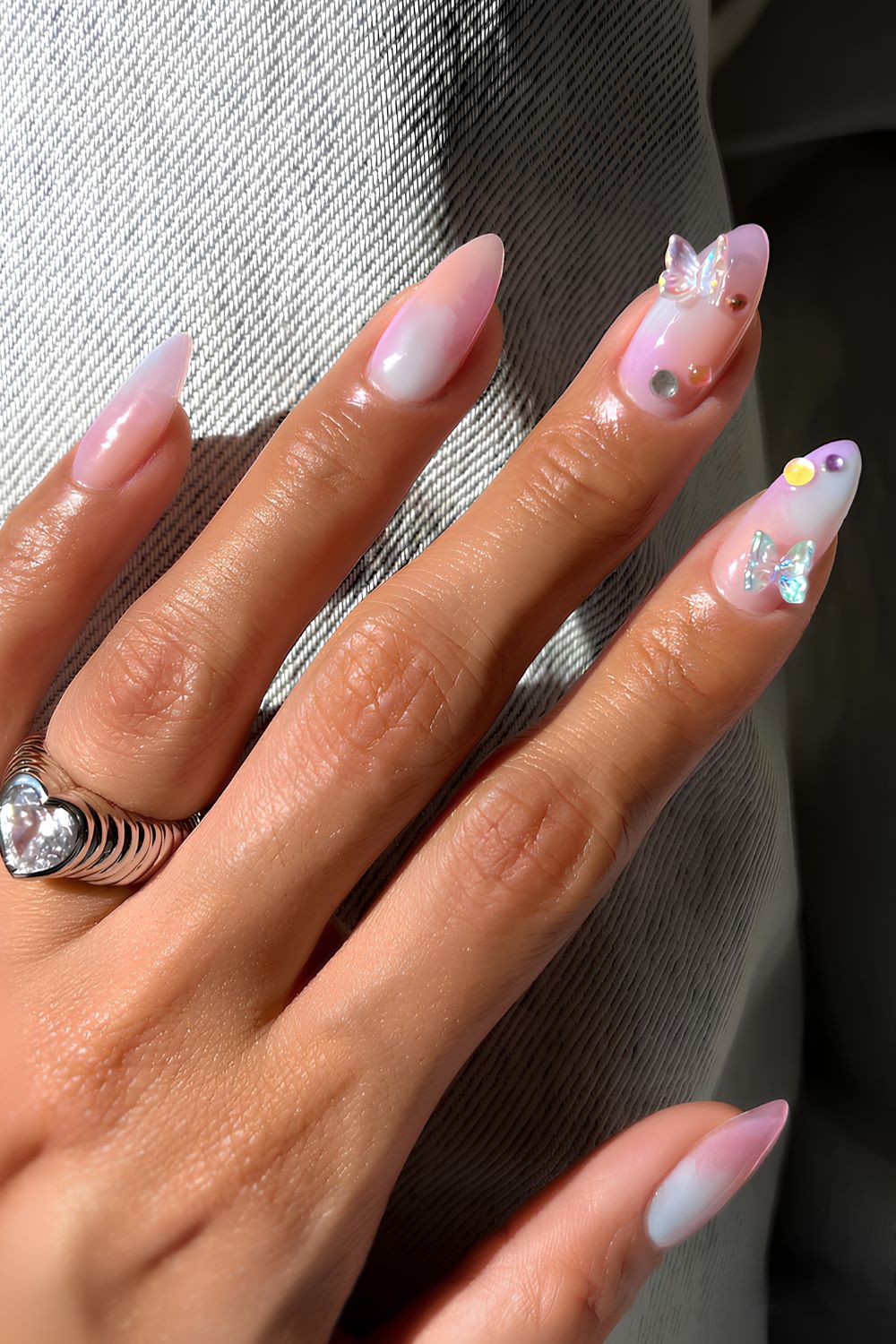 Pink and white nails with 3D butterflies