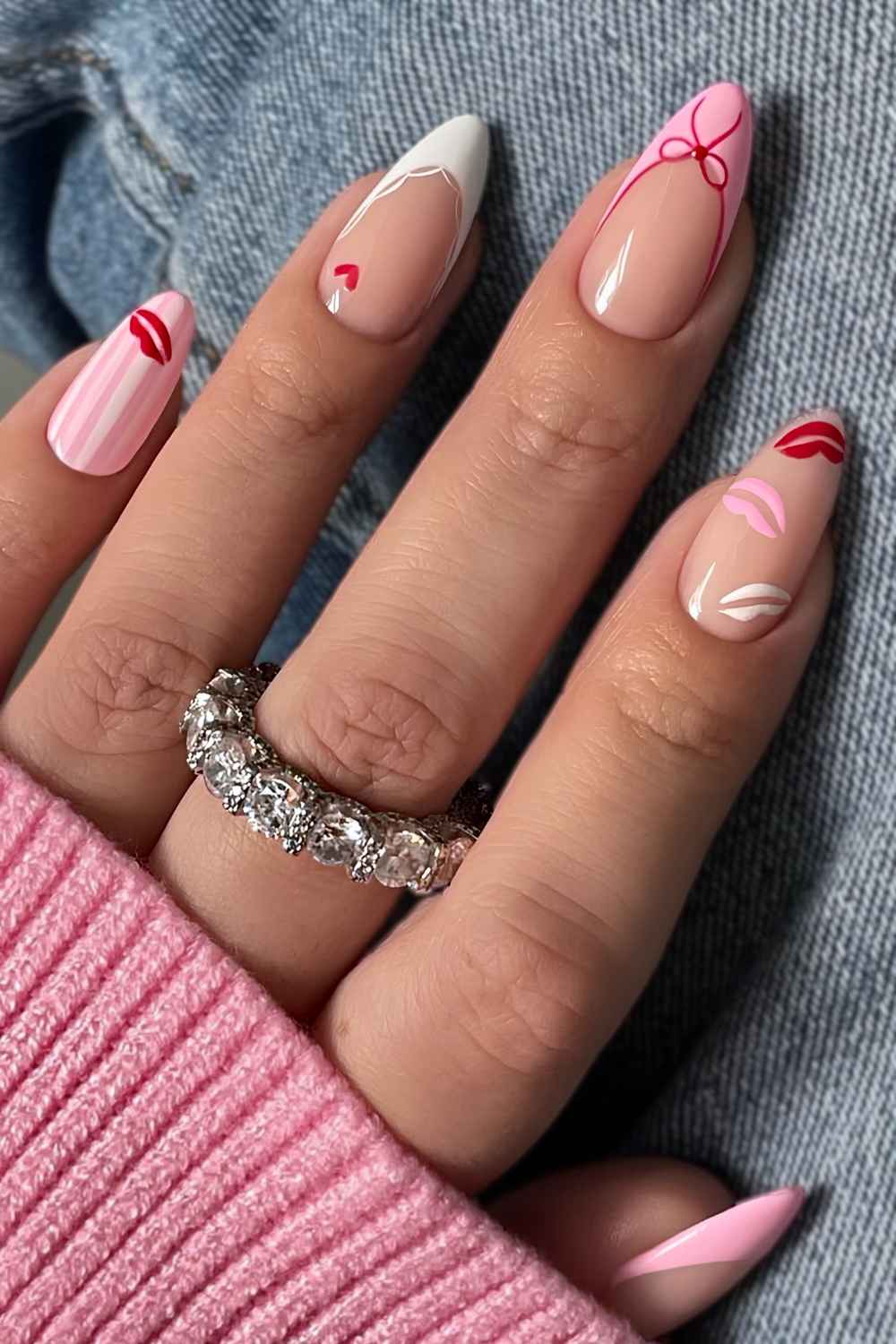 Pink and white nails with kissy lip art and bows
