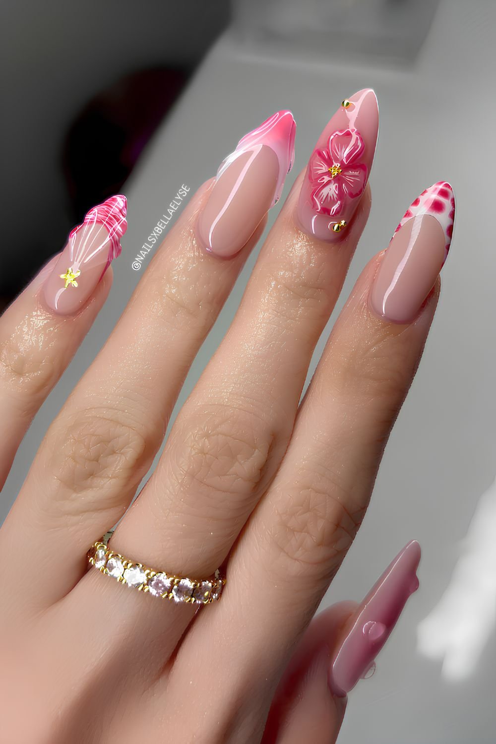 Pink and white nails with sculpted flowers