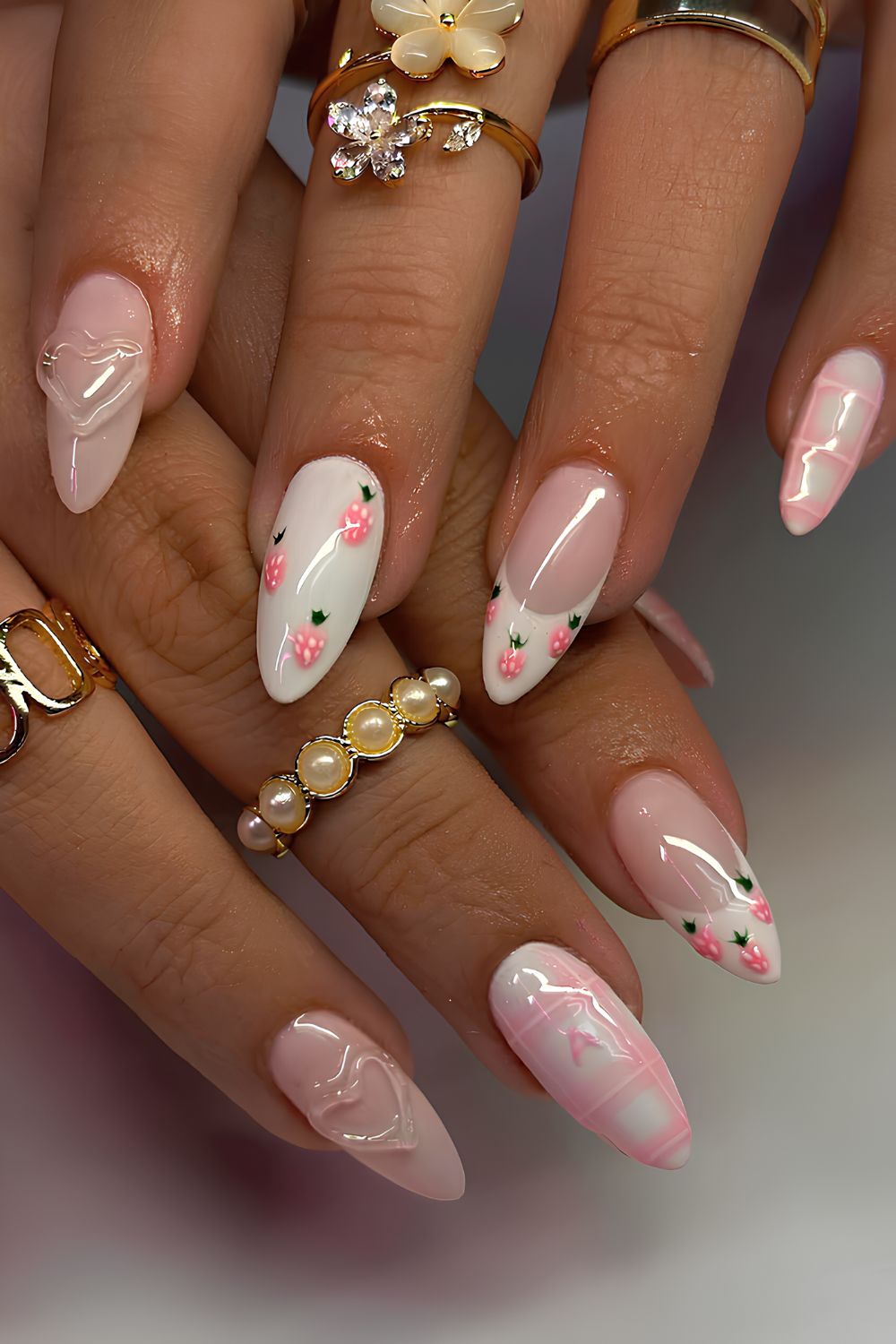 Pink and white nails with strawberries and hearts