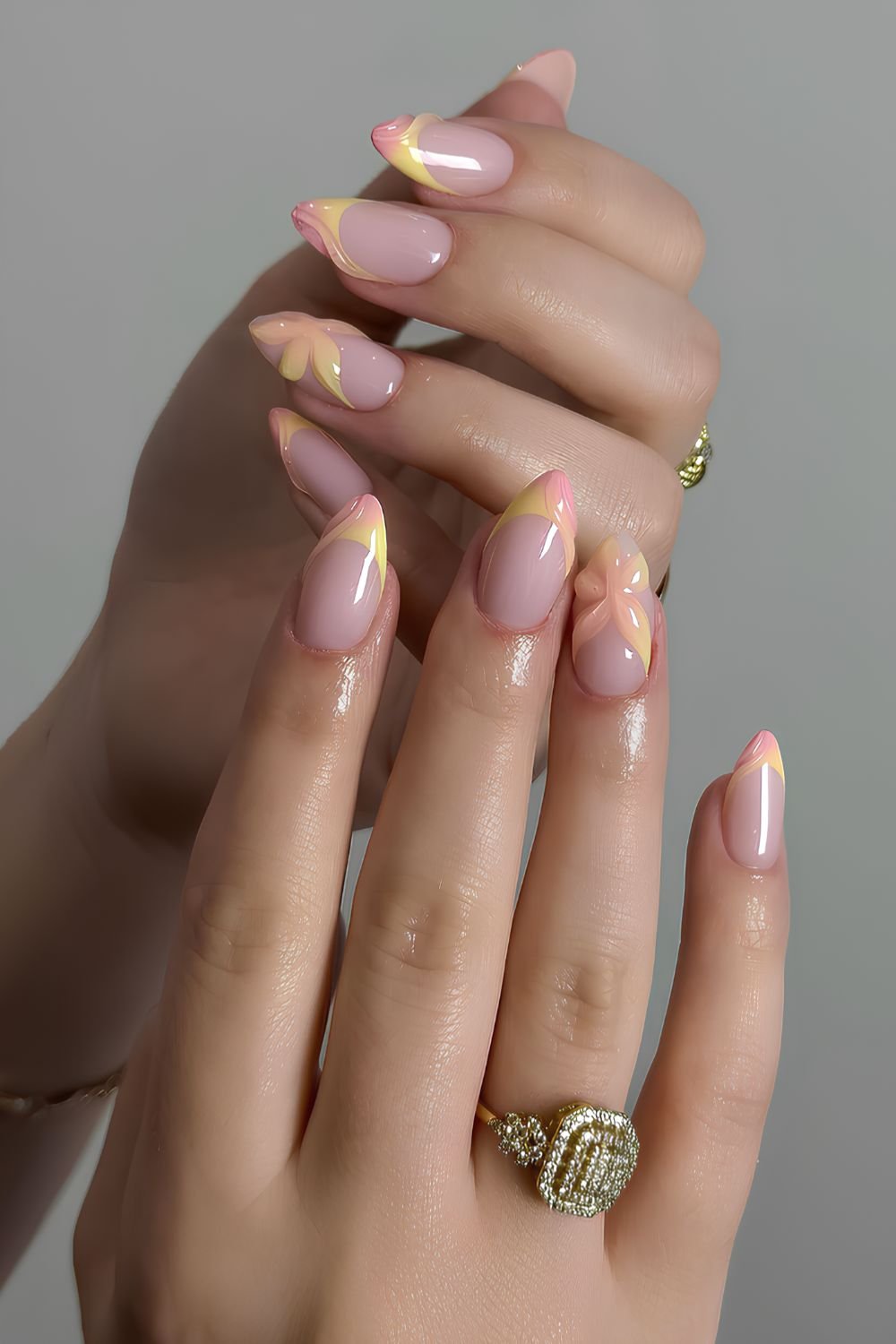 Pink and yellow French nails with textured flowers