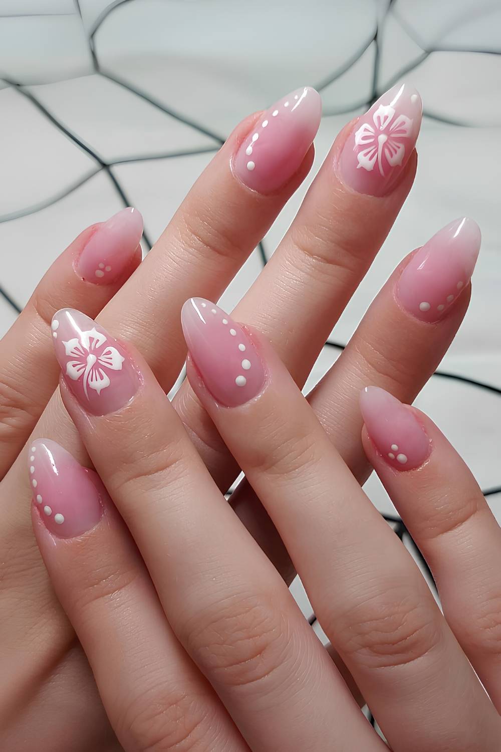 Pink aura nails with hibiscus art accents