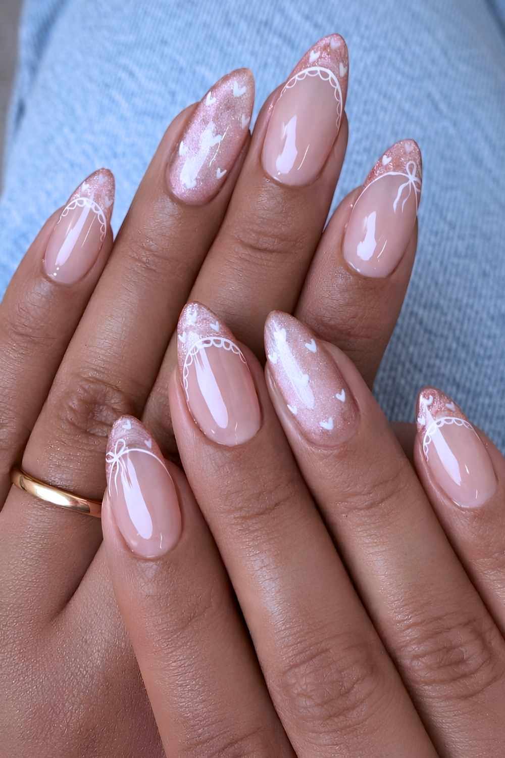 Pink cat eye nails with heart and lace art