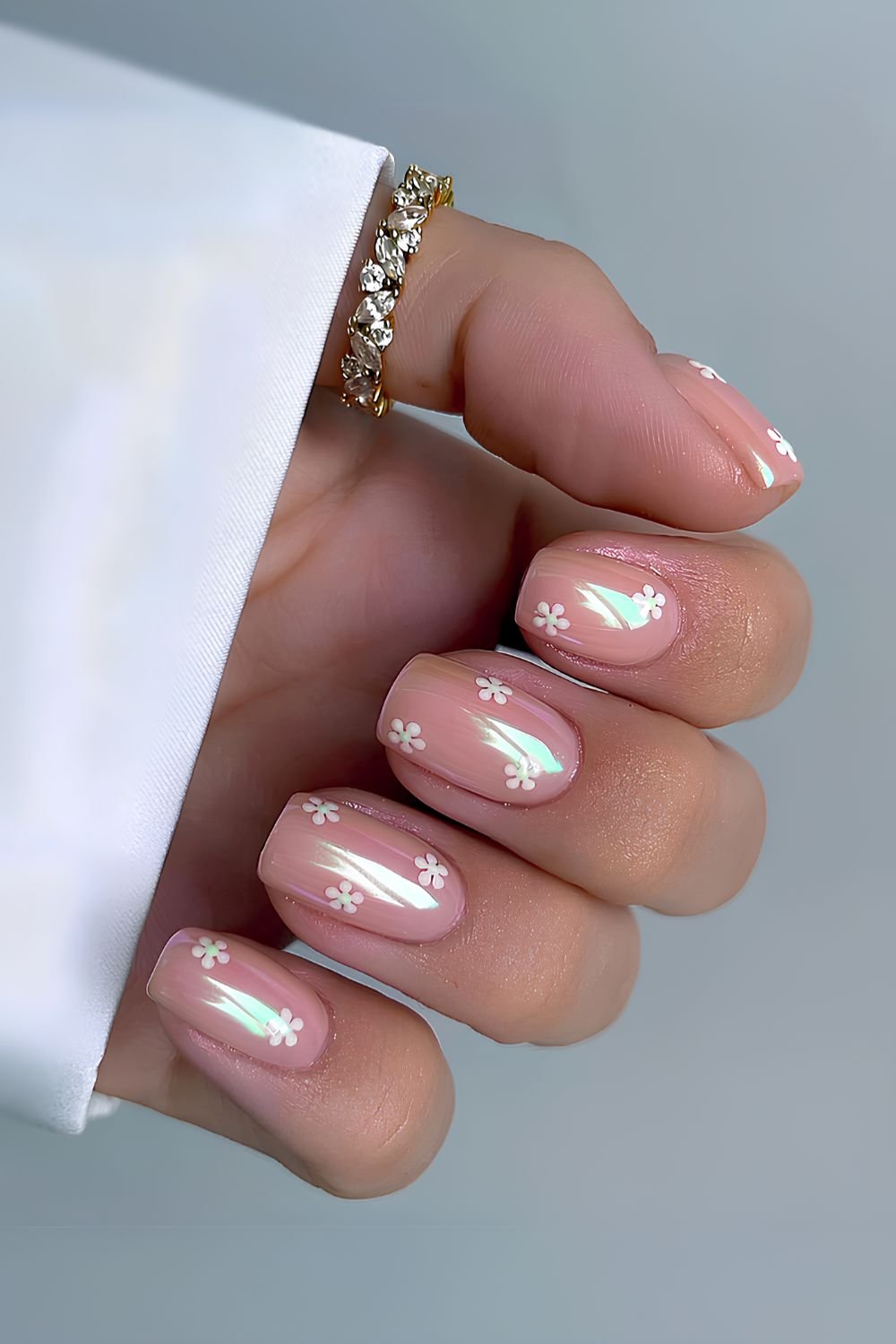Pink chrome mani with daisies