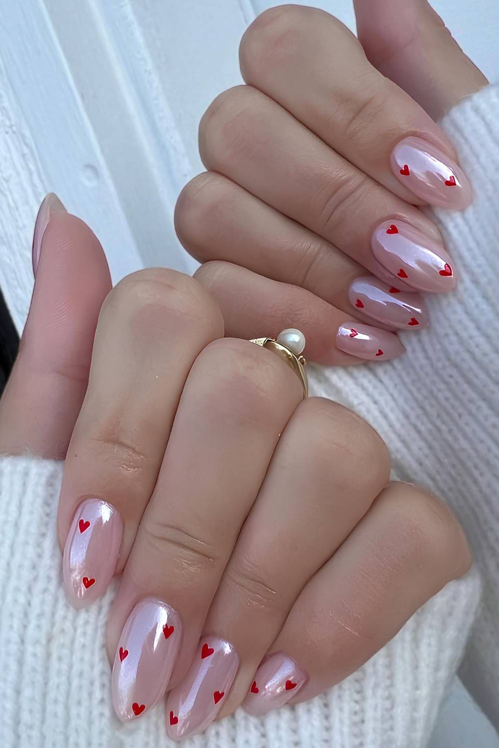 Pink chrome nails with micro hearts