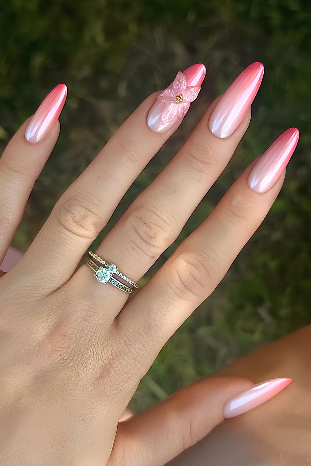 Pink chrome ombre nails with textured flowers