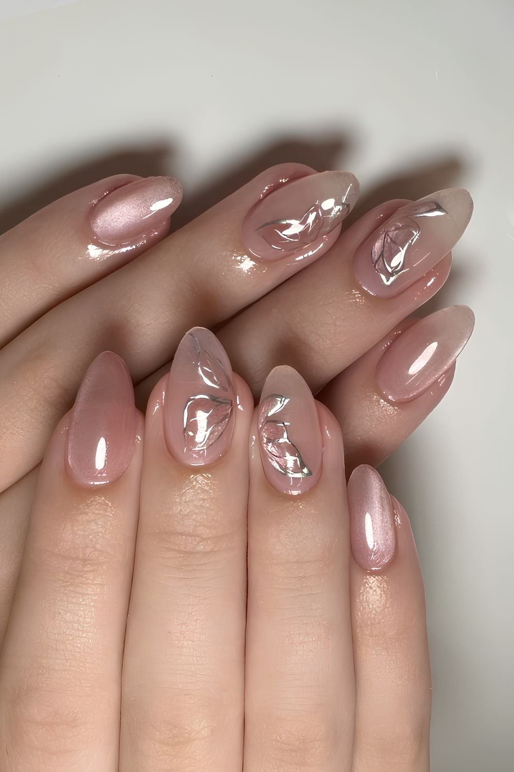 Pink jelly cat eye nails with butterflies