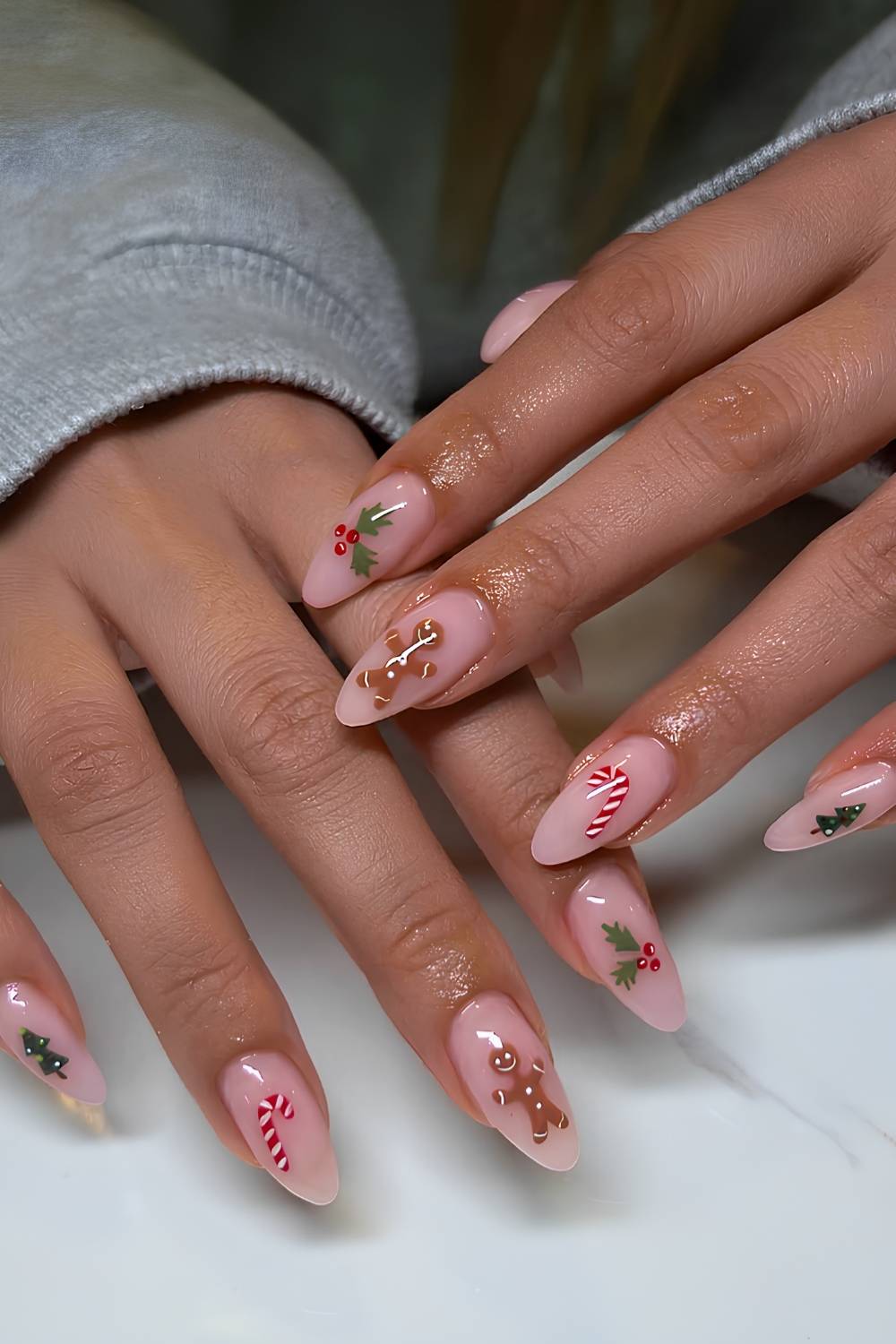 Pink mani with different Chirstmas motif on each nail