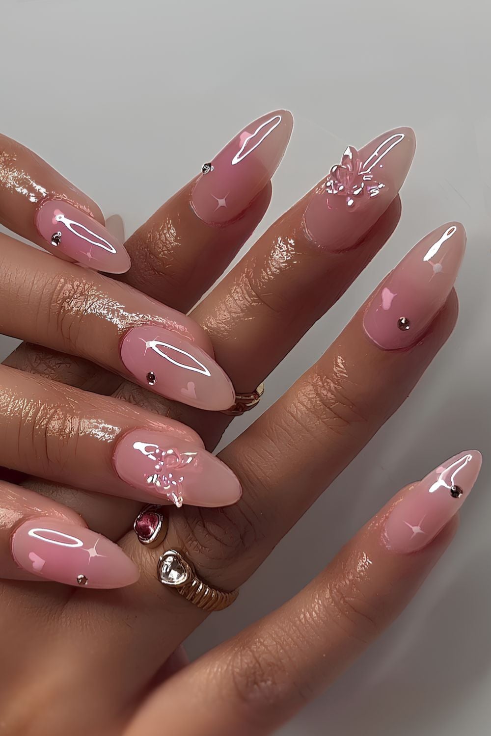 Pink mani with hearts and butterflies