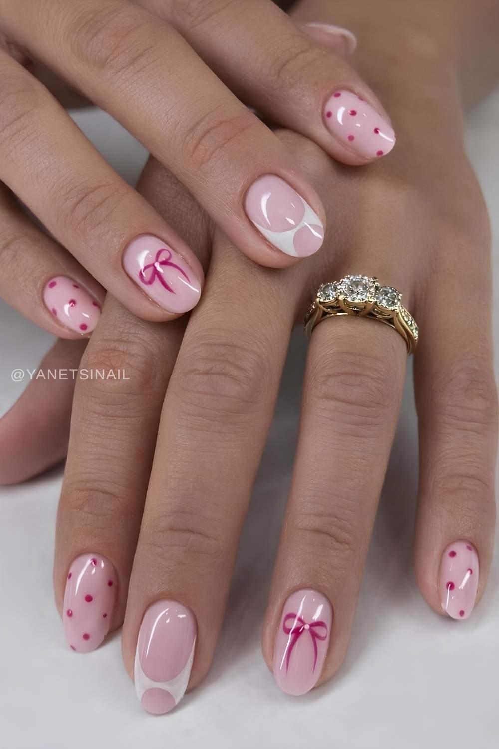 Pink nails with bows and dot art