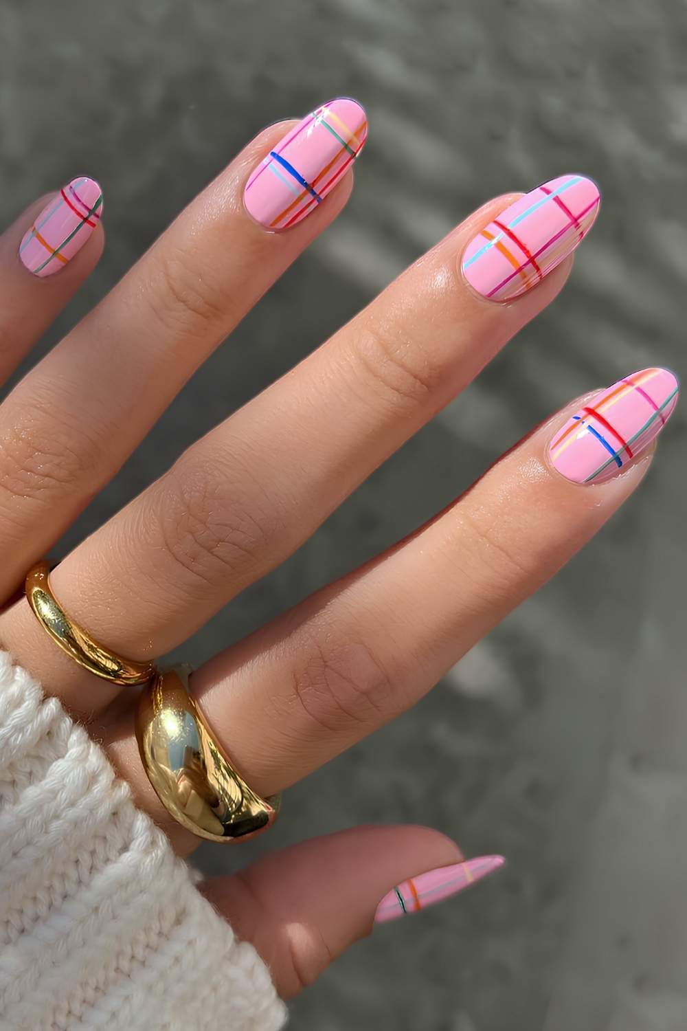 Pink nails with colorful plaid lines