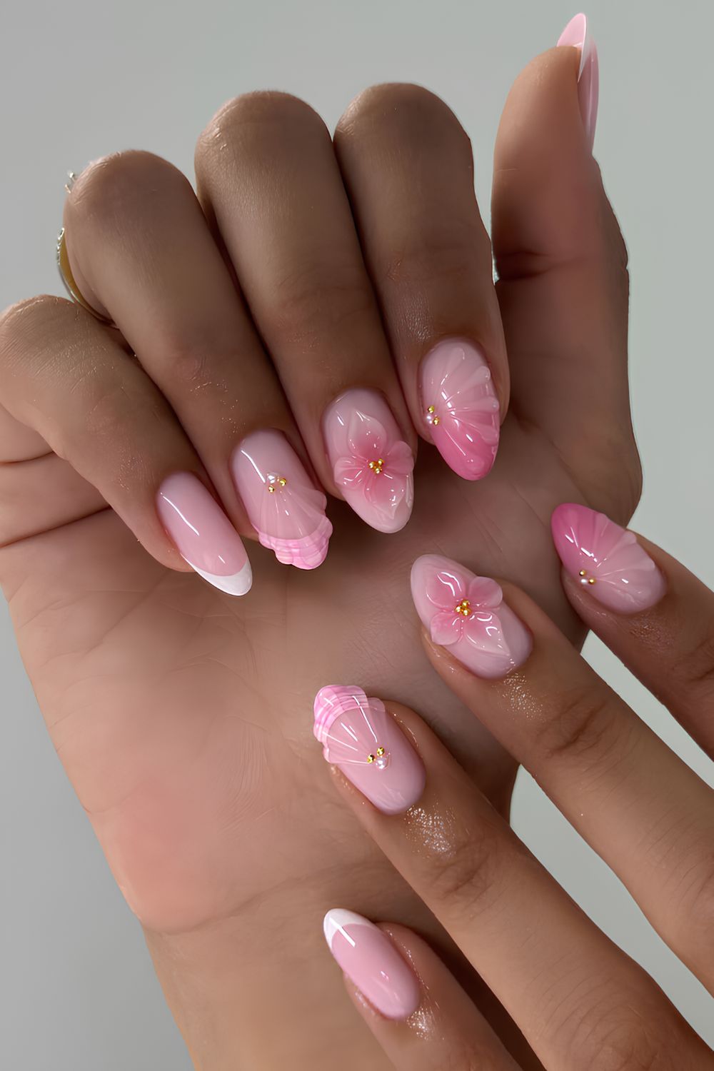Pink nails with flowers and seashell art