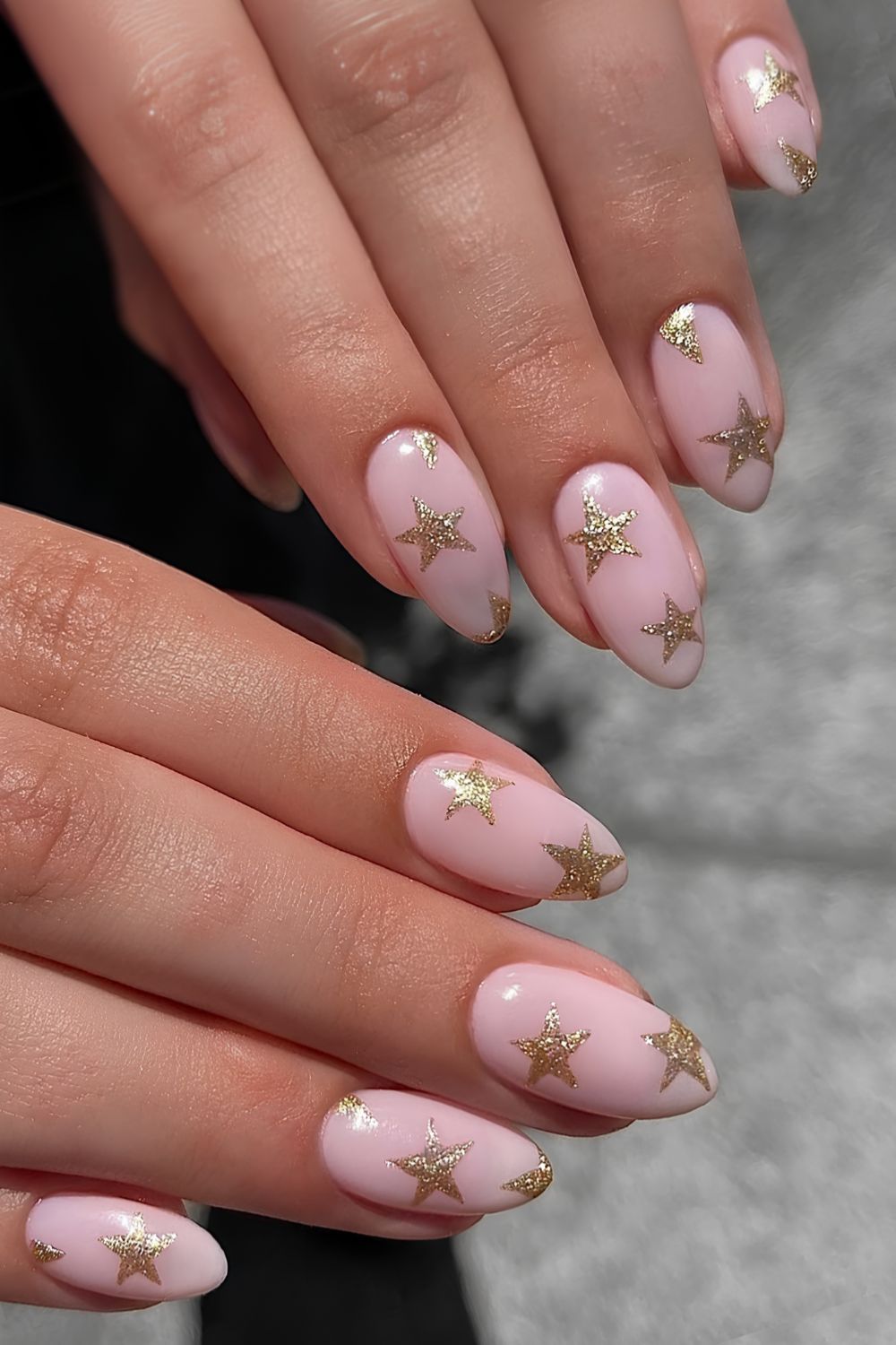 Pink nails with gold star art