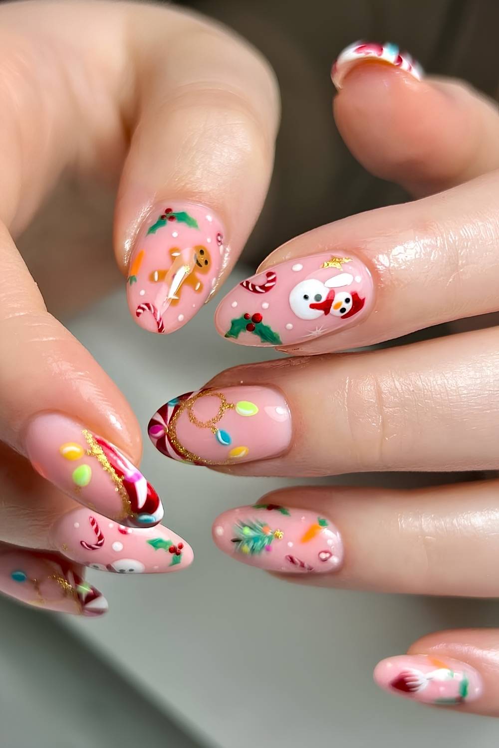 Pink nails with micro Christmas motifs