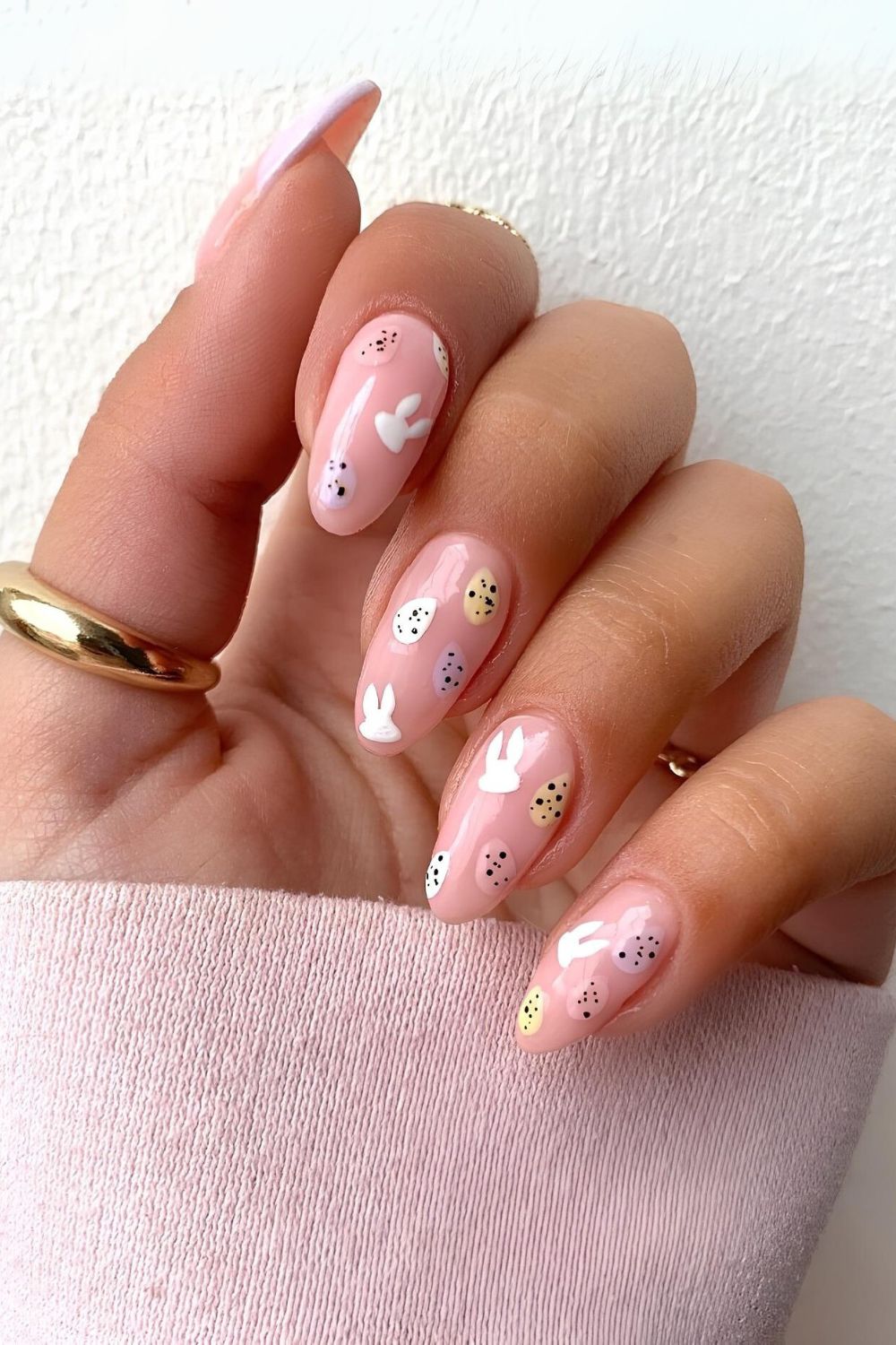 Pink nails with mini Easter eggs and bunny faces