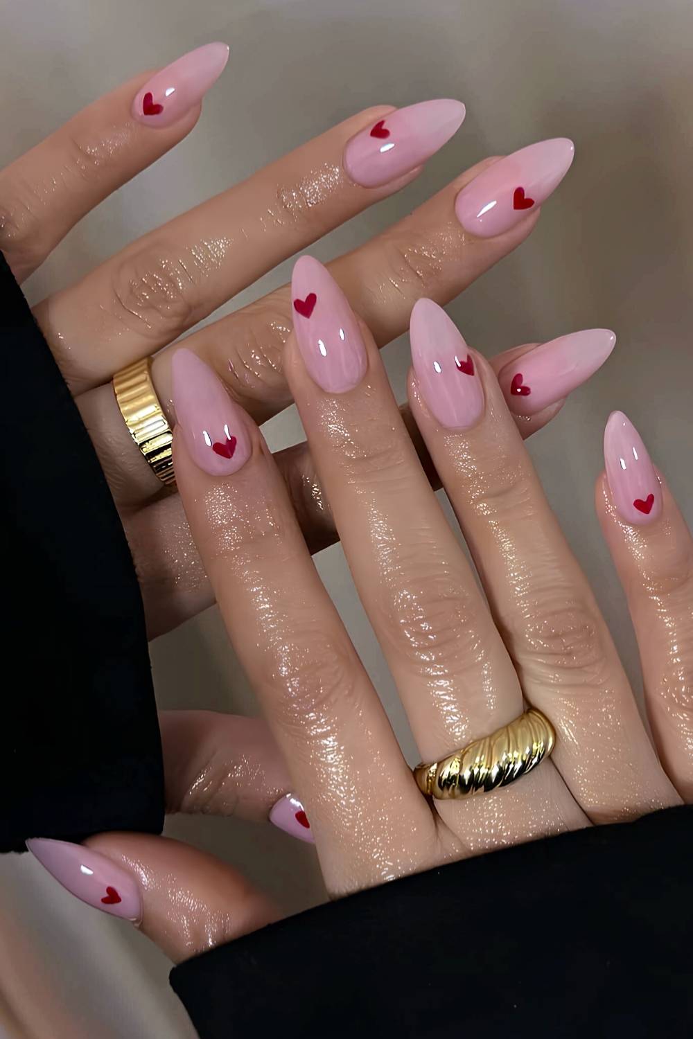 Pink nails with red micro heart art