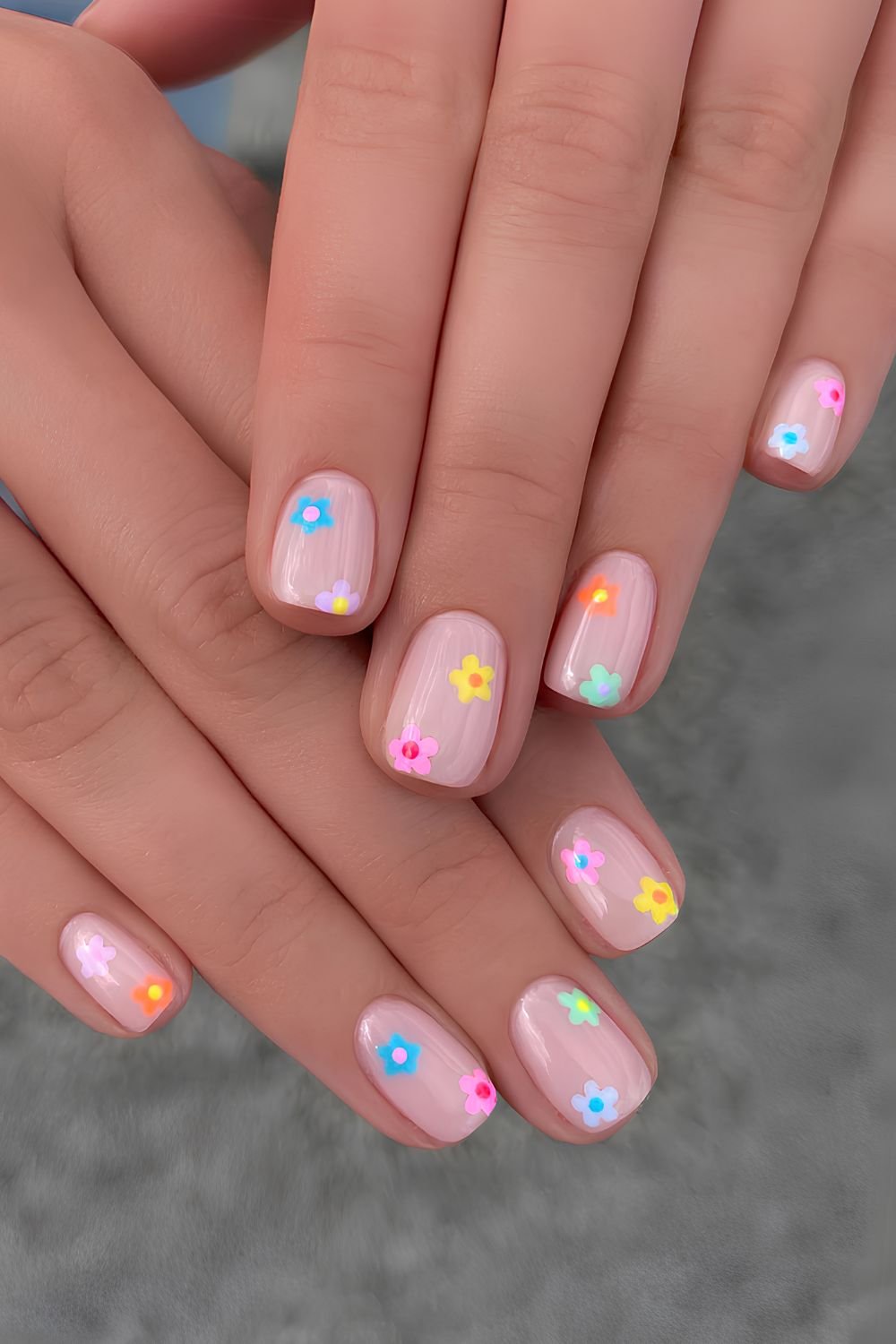 Pink nails with tiny colorful flowers