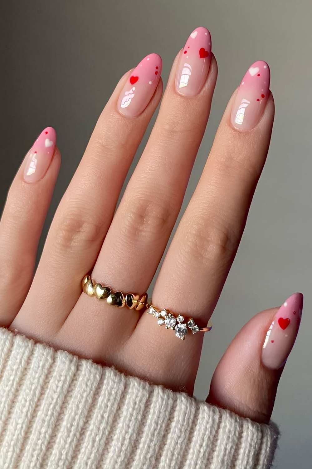 Pink ombre mani with hearts and dots