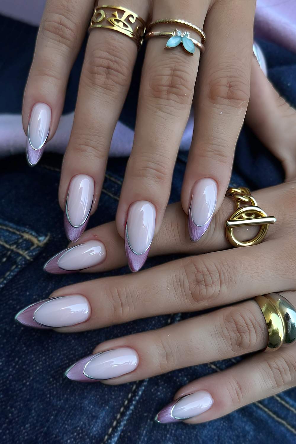 Purple cat eye French nails with silver outlines
