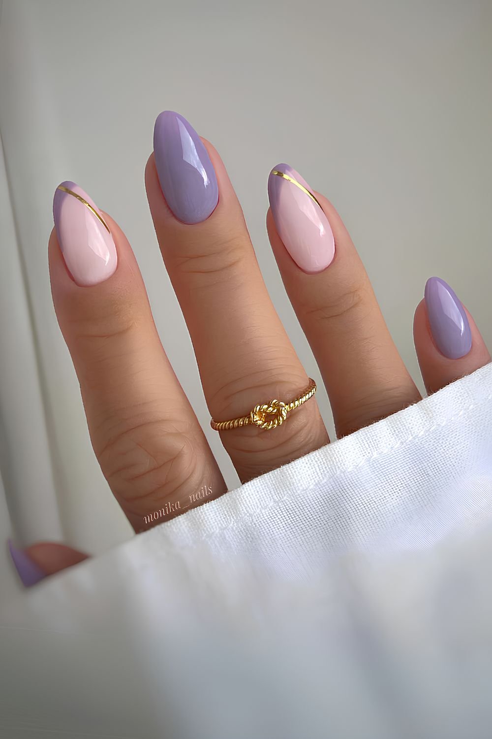 Purple nails with accent gold lines