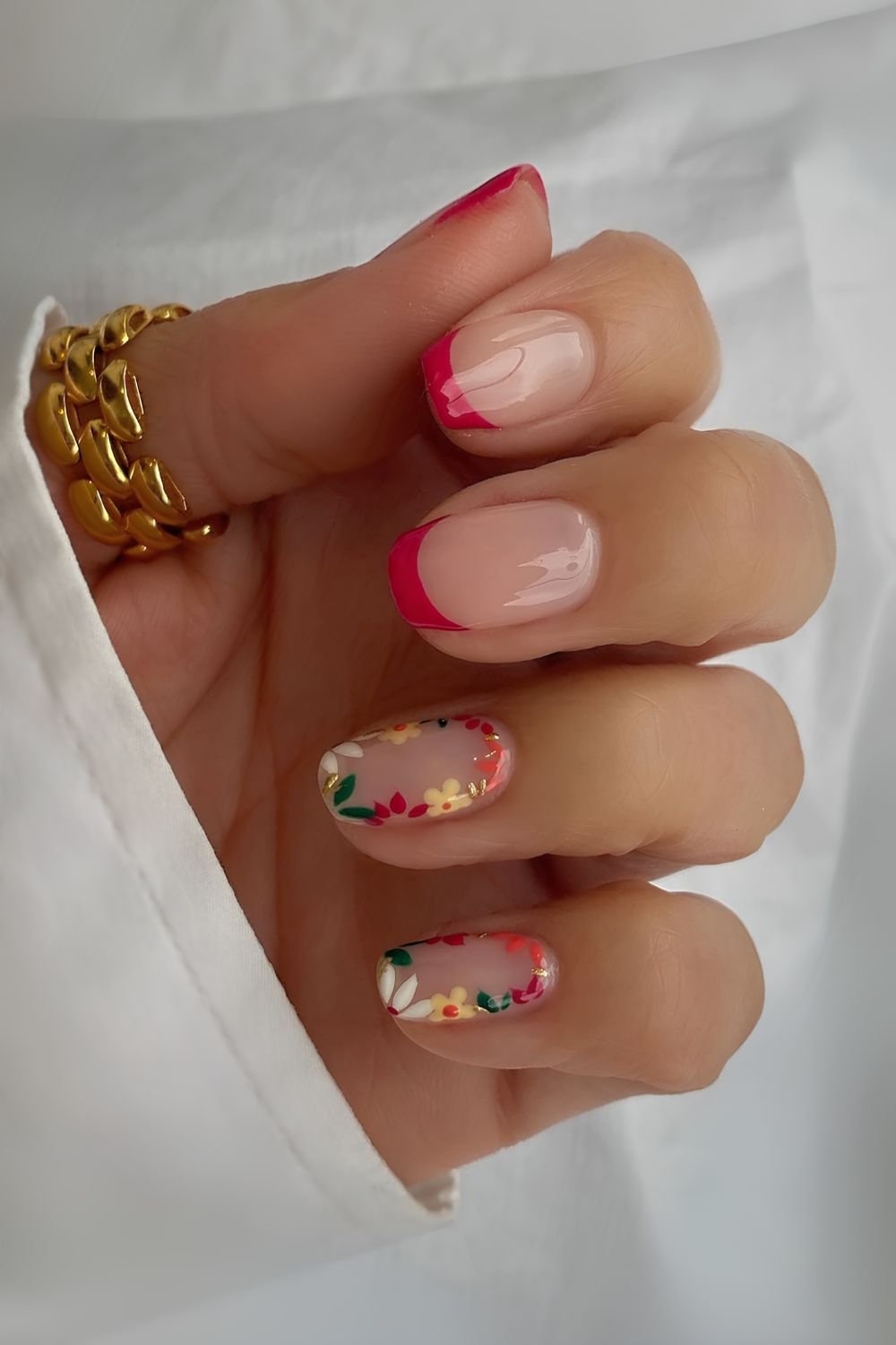 Red French mani with accent flowers