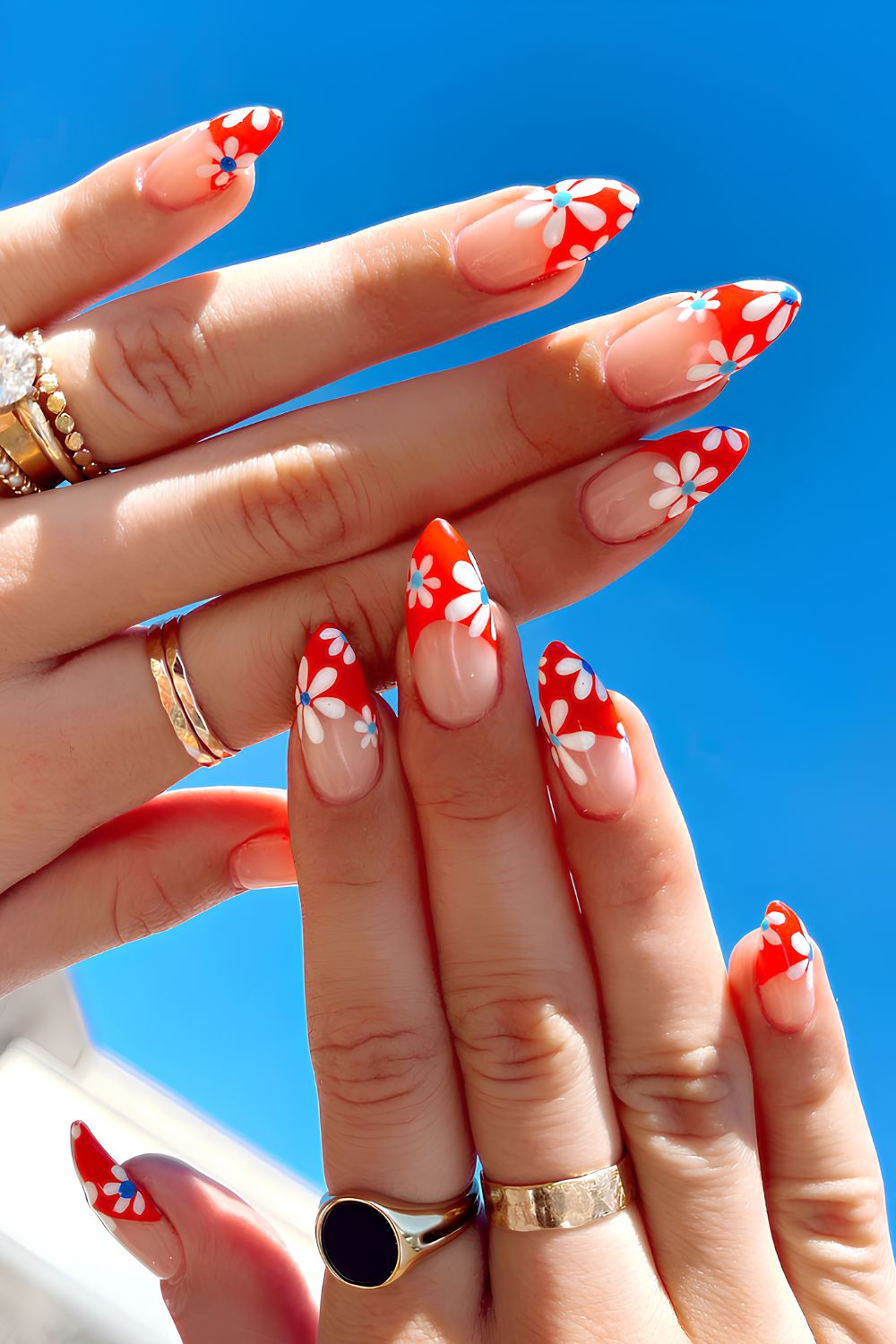 Red French mani with and blue flowers