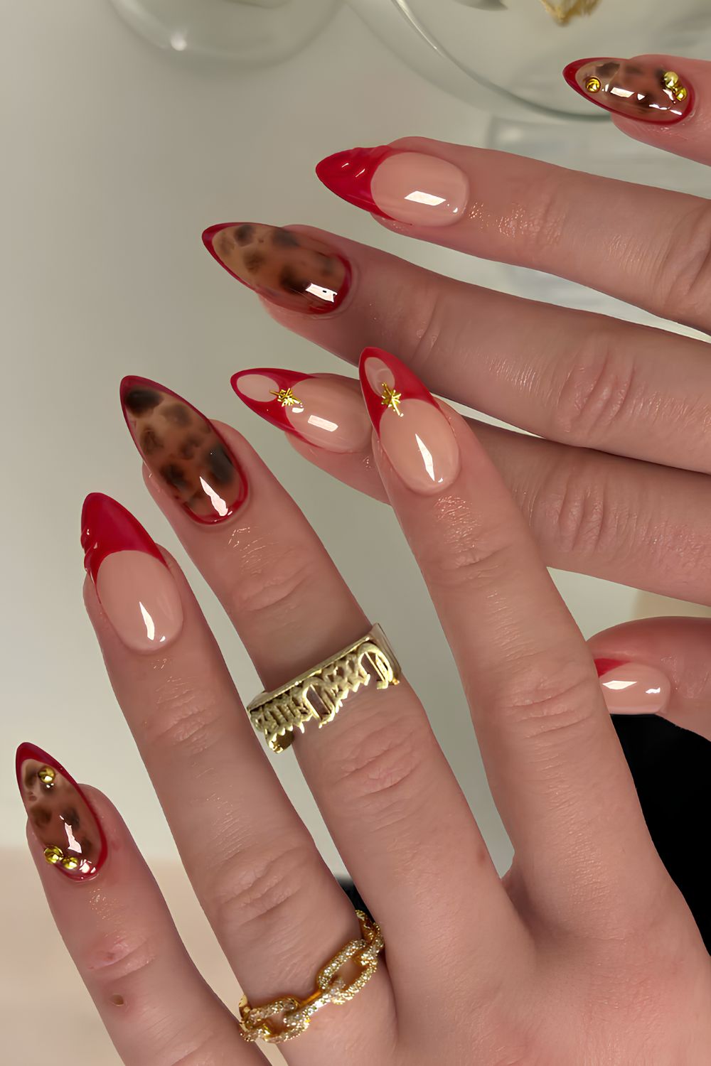 Red French mani with tortoise shell accents
