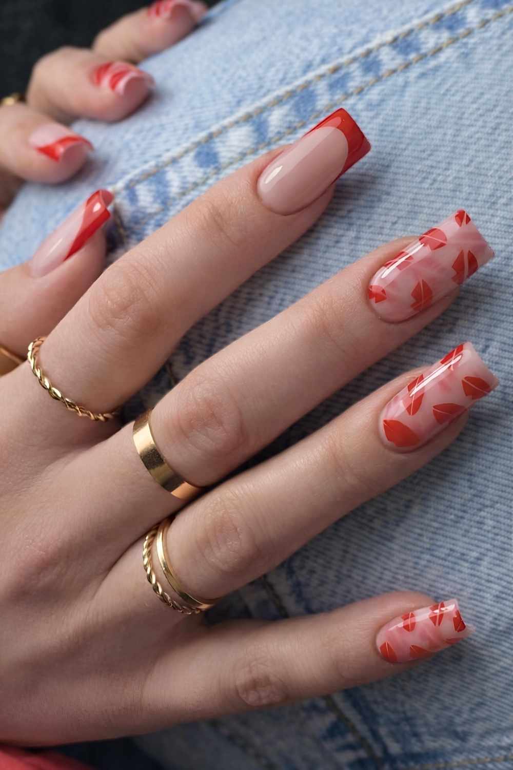 Red French manicure with kiss art