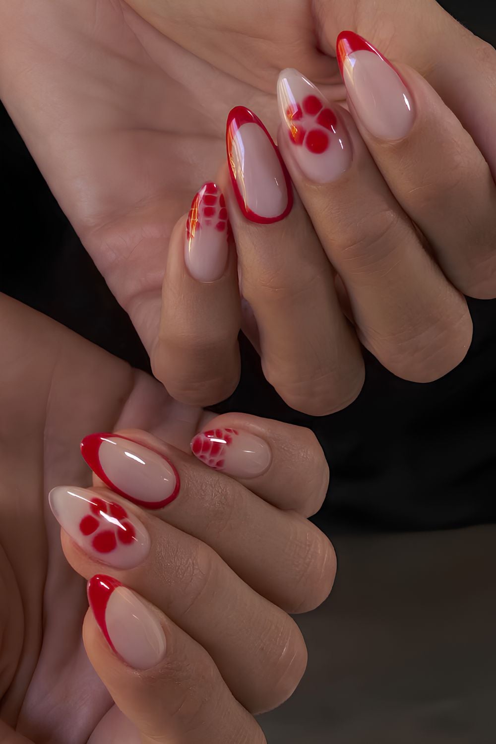 Red French nails with animal print and blooming flowers