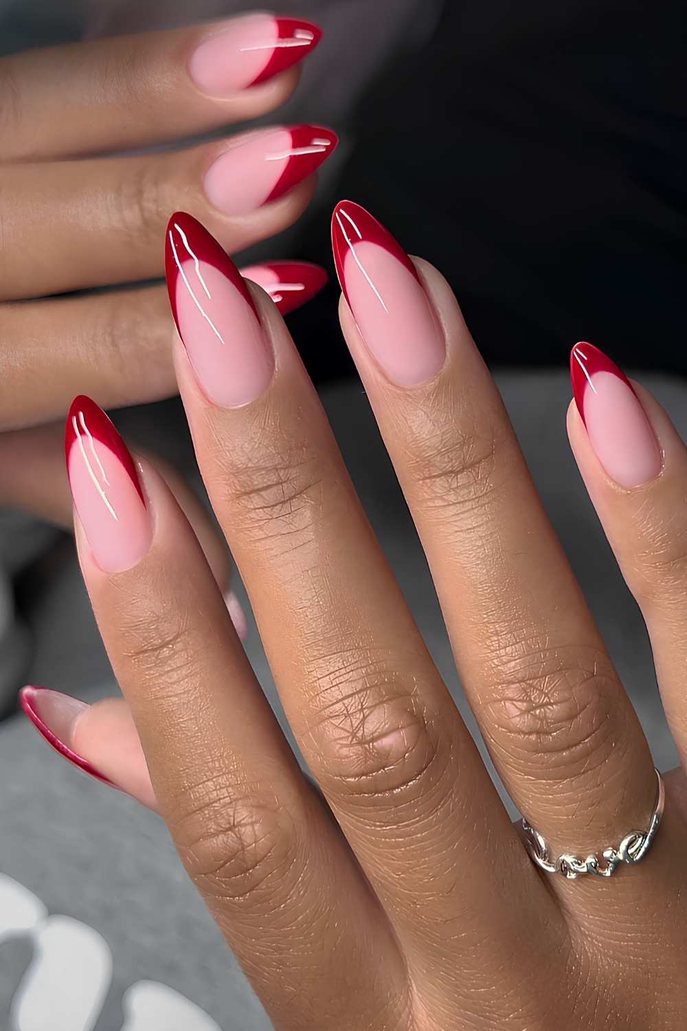 Red French tip mani on a pink base