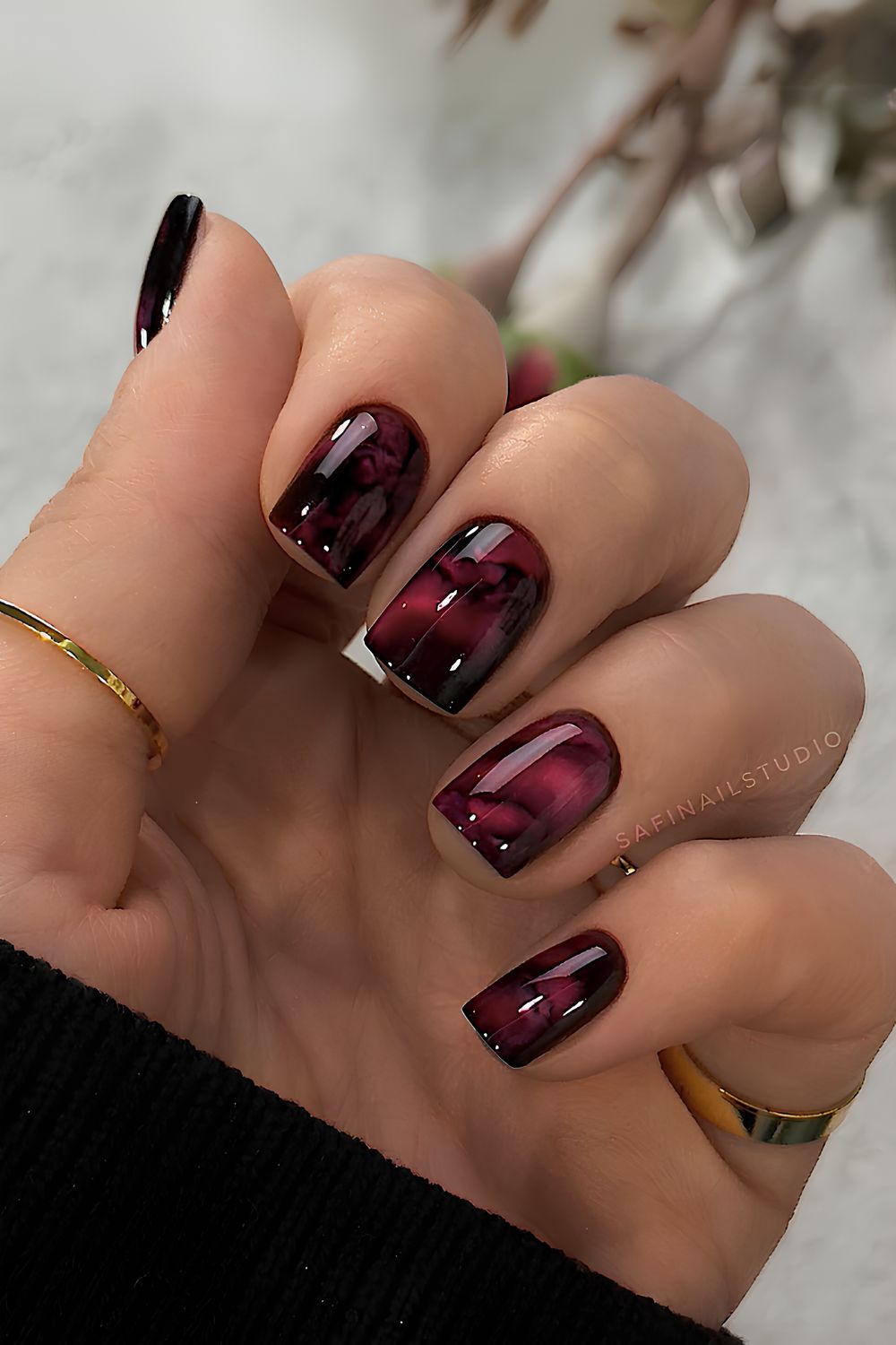 Red and black marble effect nails
