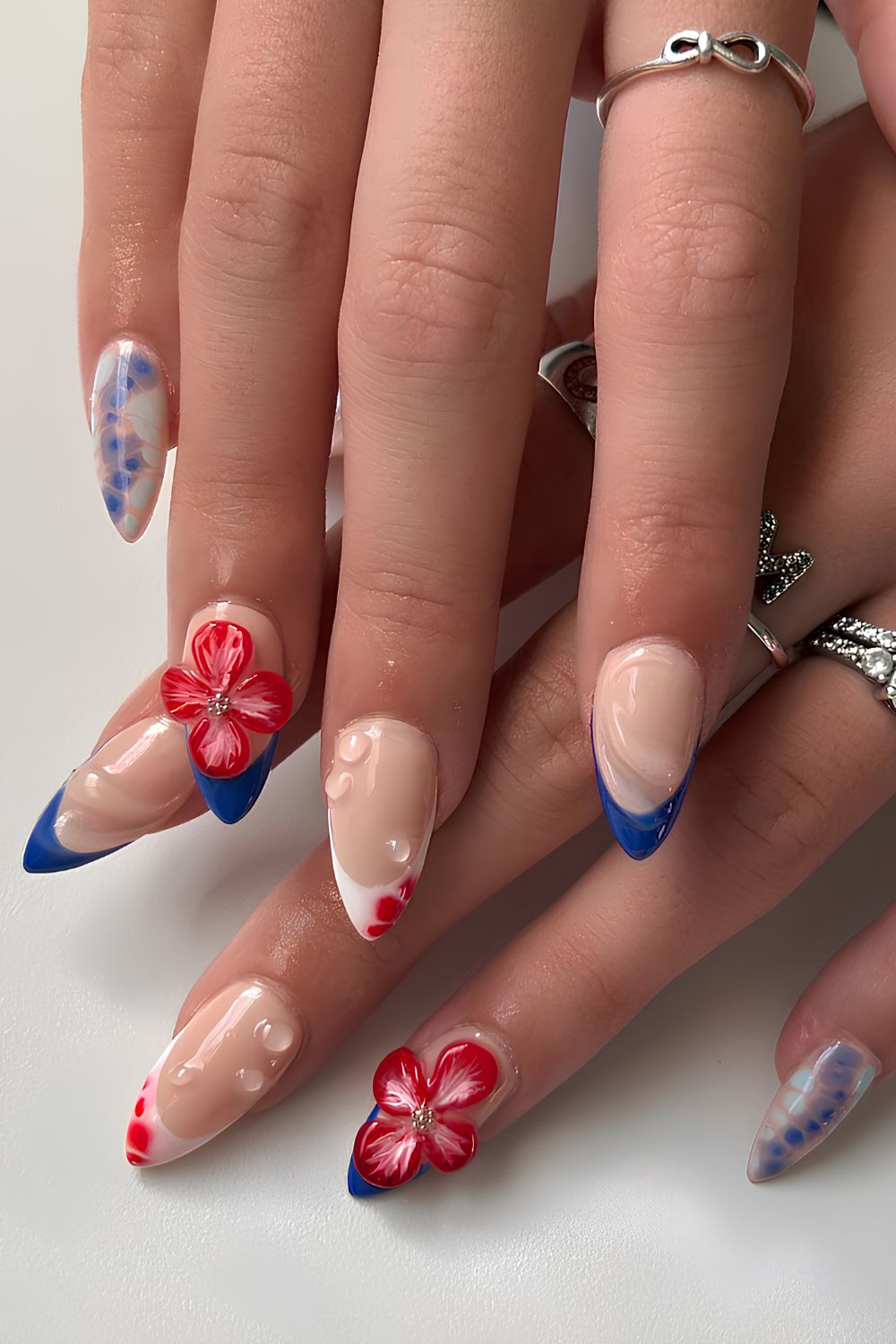 Red and blue nails with 3d florals