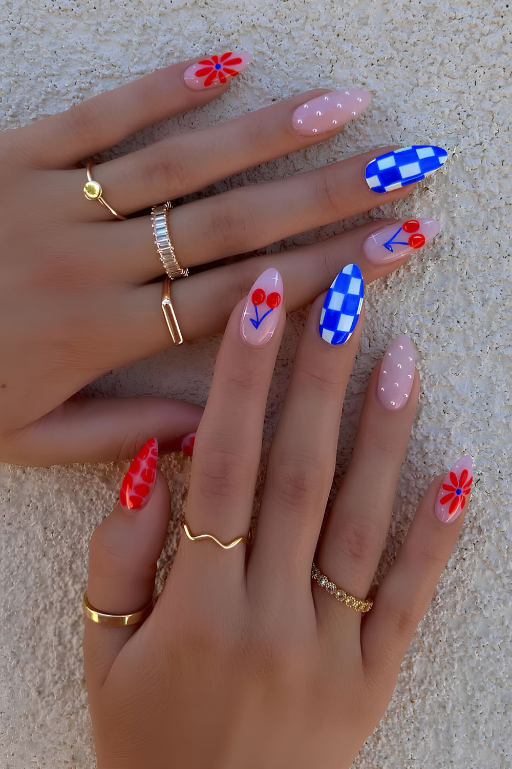 Red and blue nails with checkerboards and cherries