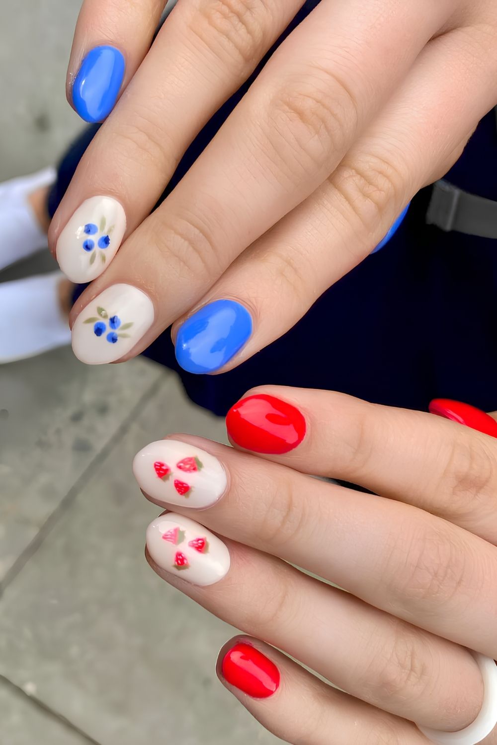 Red and blue nails with fruit art
